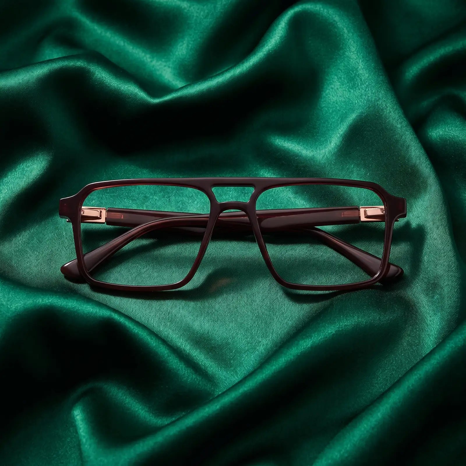 Fiore 1039 eyeglasses in brown – nested in flowing emerald silk