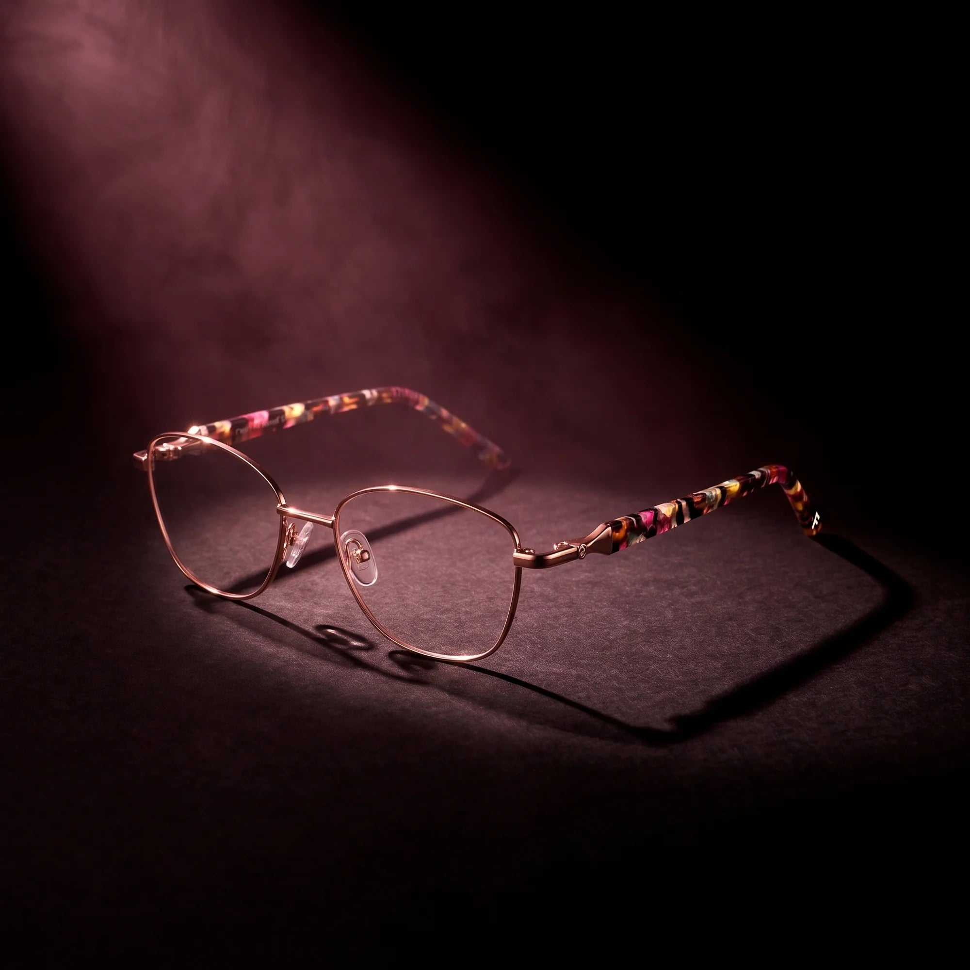 Fiore 2208 eyeglasses in brown gold – under a theatrical beam of light