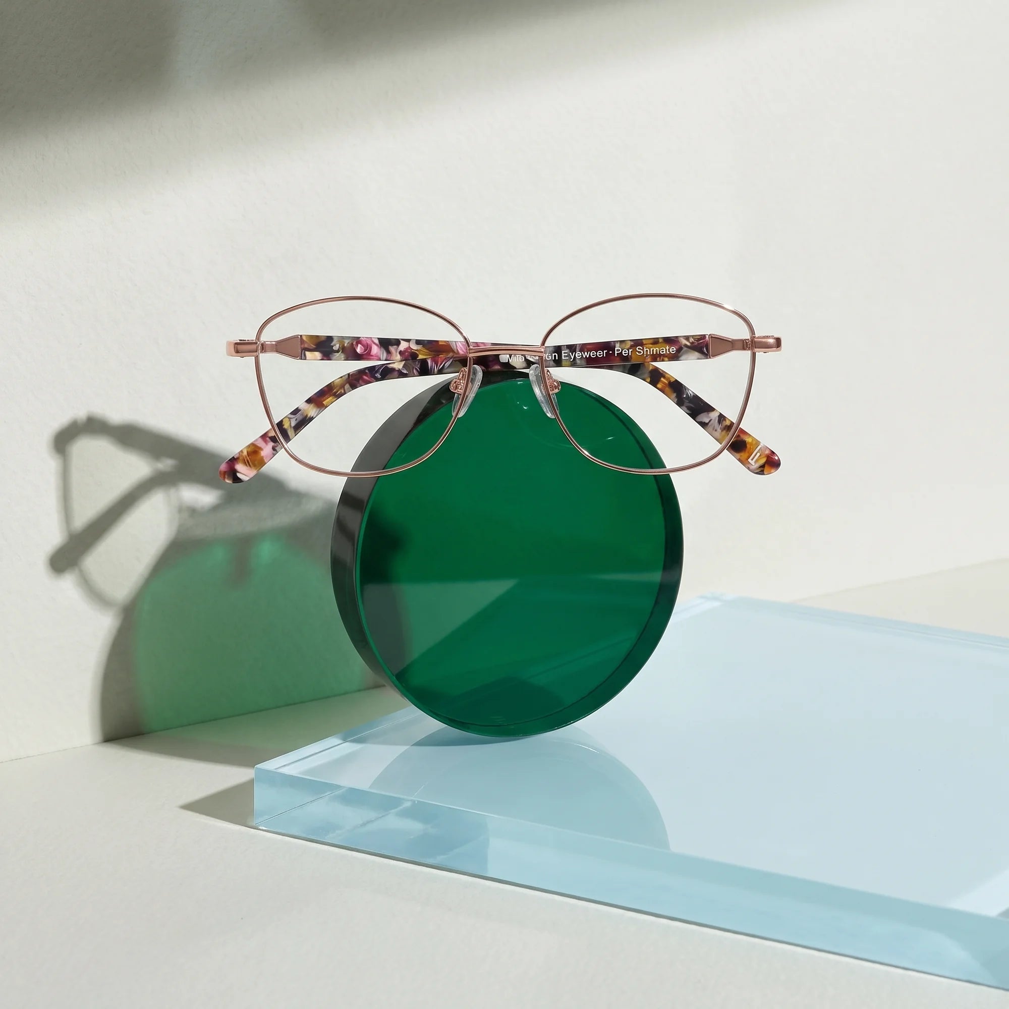 Fiore 2208 eyeglasses in brown tortoiseshell – on a cobalt acrylic disc in soft daylight