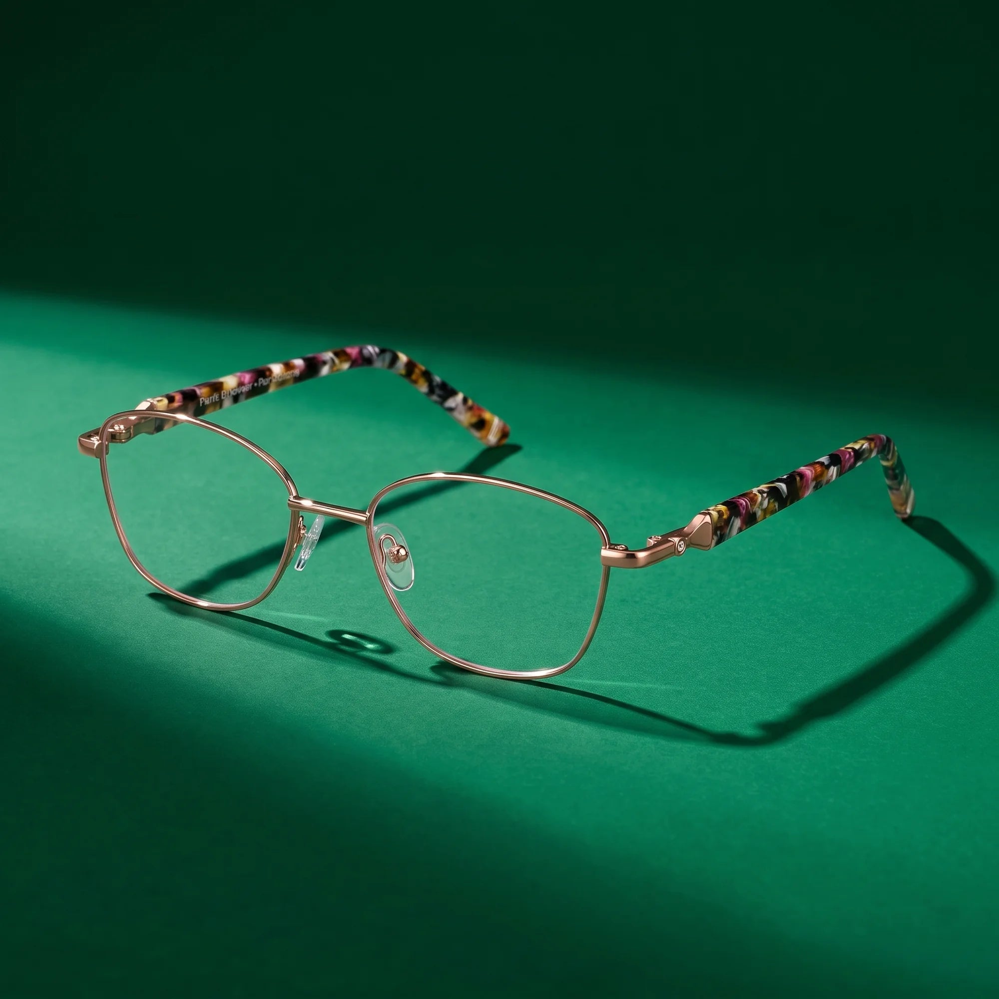 Fiore 2208 eyeglasses in brown tortoiseshell – still life on a seamless emerald studio backdrop