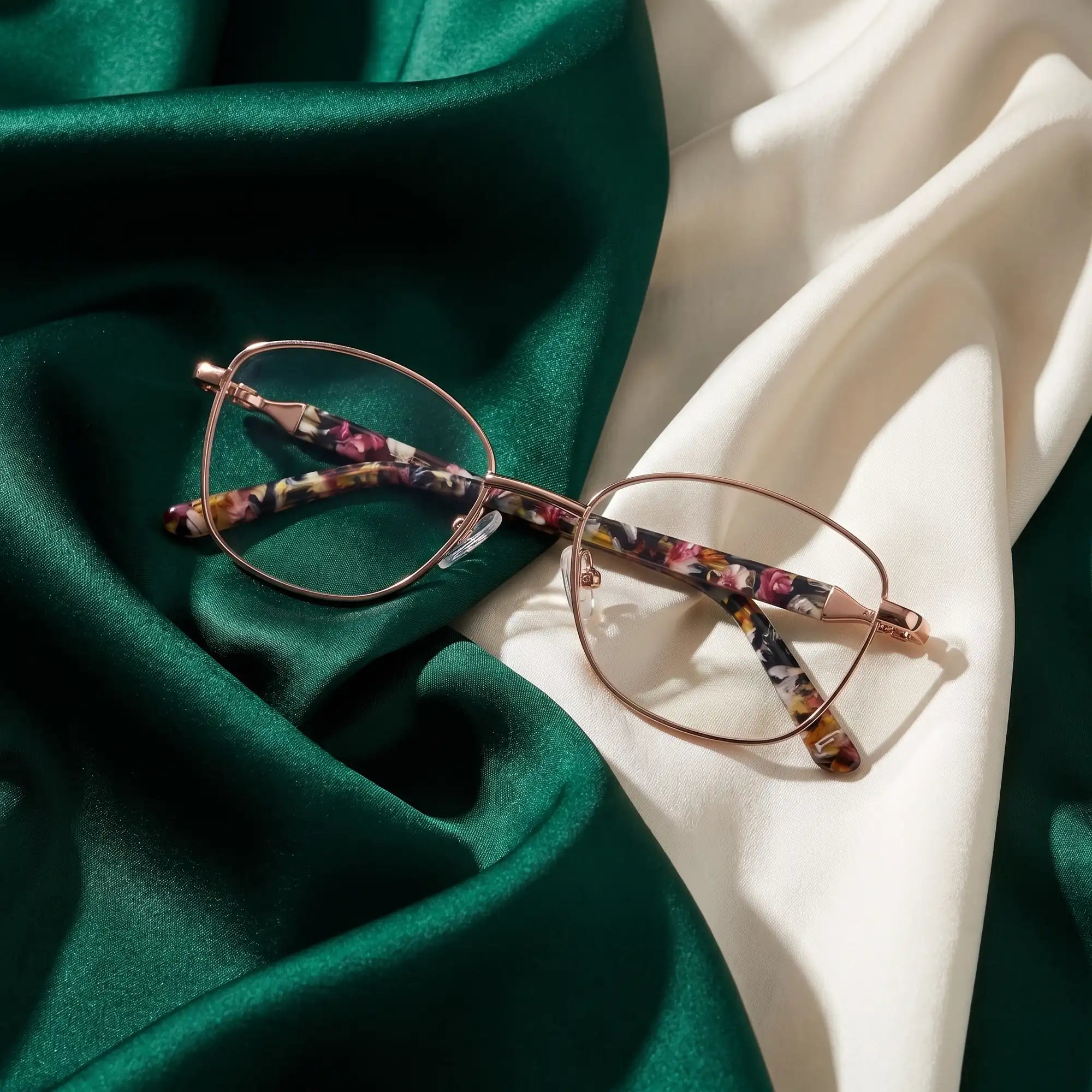 Fiore 2208 eyeglasses in brown tortoiseshell – resting on draped emerald and ivory silk