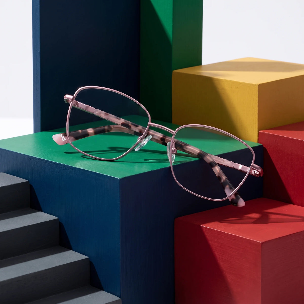Fiore 2210 eyeglasses in pink – on bold primary color-block steps