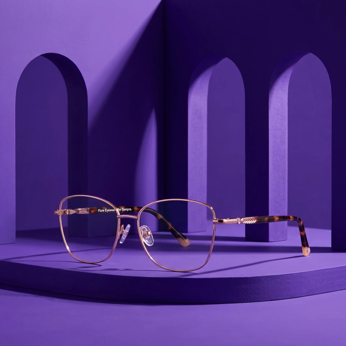 Fiore 2210 eyeglasses in gold pink – staged on a sculptural violet architecture set