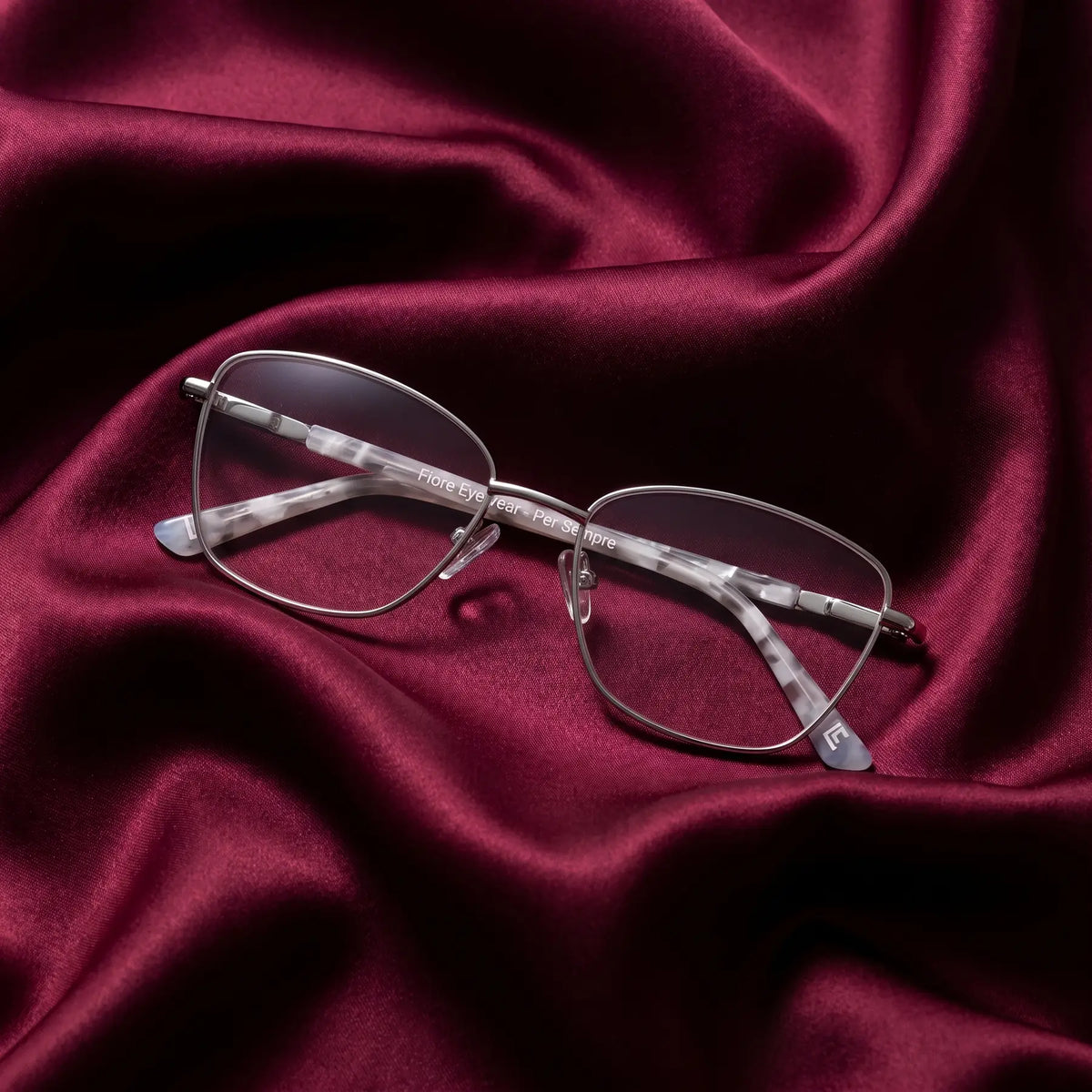 Fiore 2210 eyeglasses in silver black – nested in flowing burgundy silk