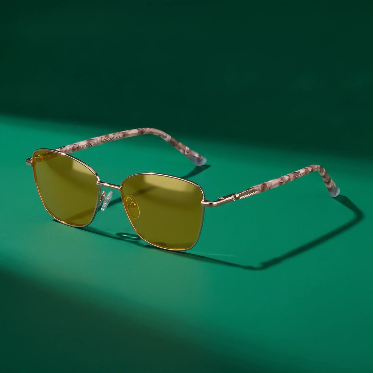 Fiore 2210 square cat eye sunglasses, gold steel frame, editorial still (angle 4) · ReFramed