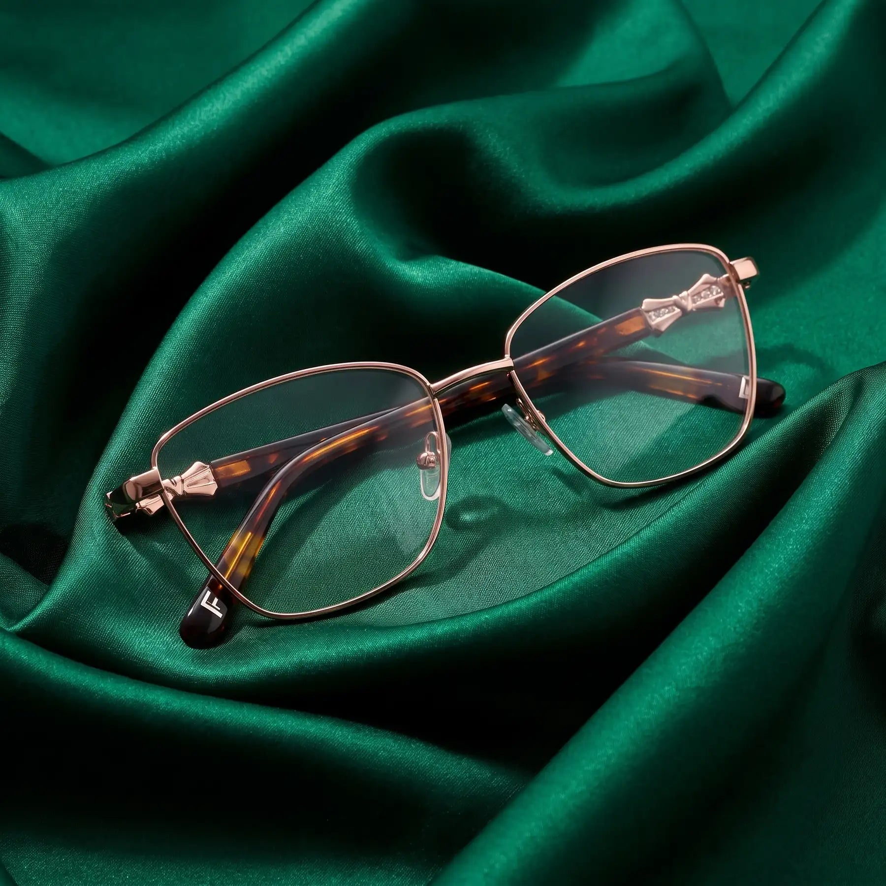 Fiore 22115 eyeglasses in brown – nested in flowing emerald silk
