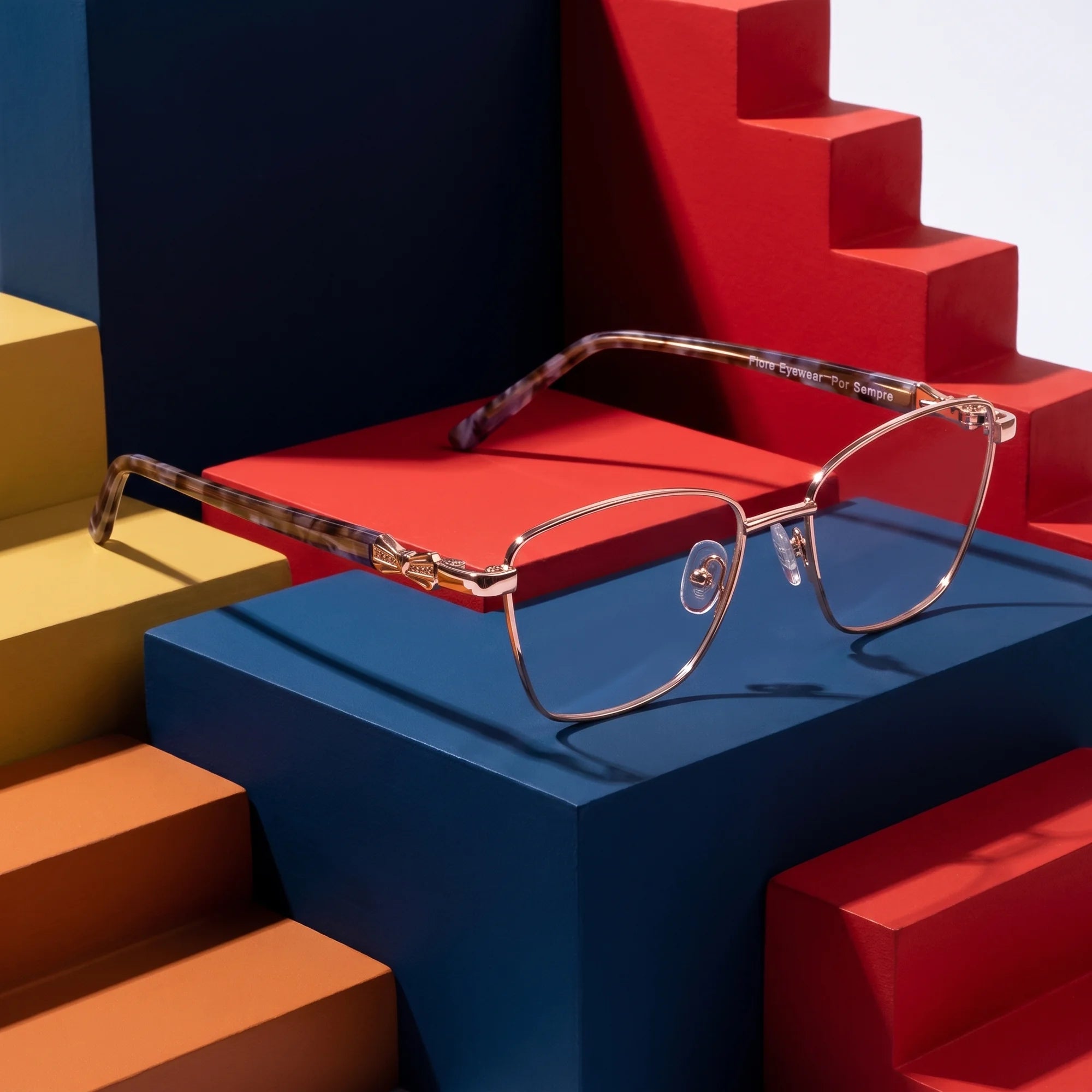 Fiore 22115 eyeglasses in gold – on bold primary color-block steps