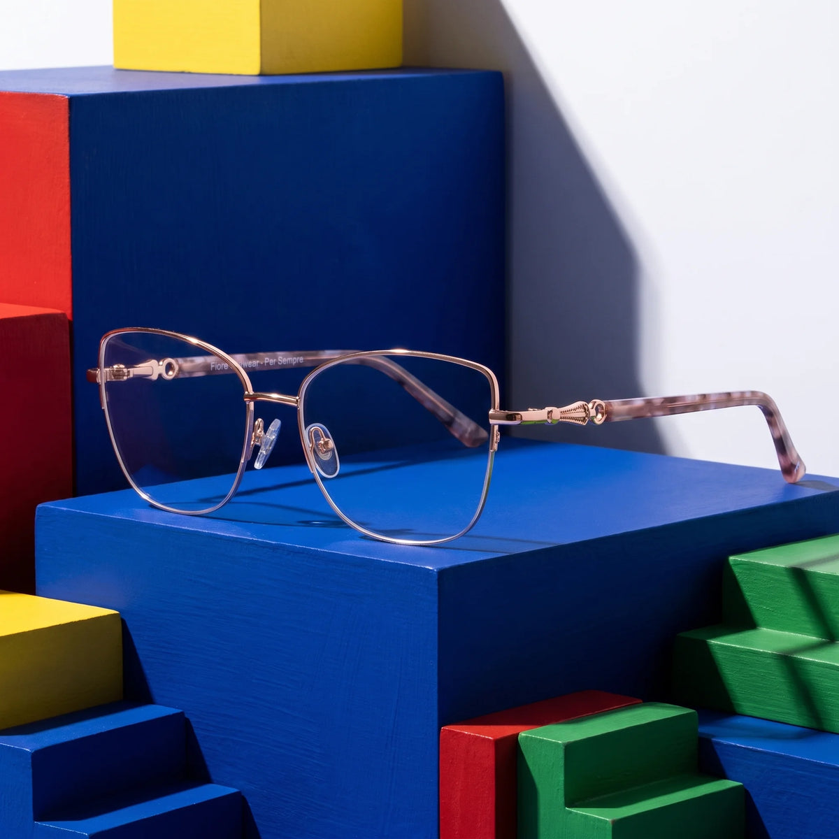 Fiore 22117 eyeglasses in gold – on bold primary color-block steps
