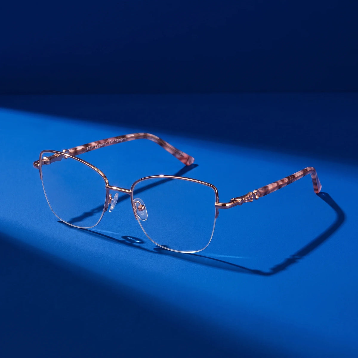 Fiore 22117 eyeglasses in gold – still life on a seamless saturated color studio backdrop