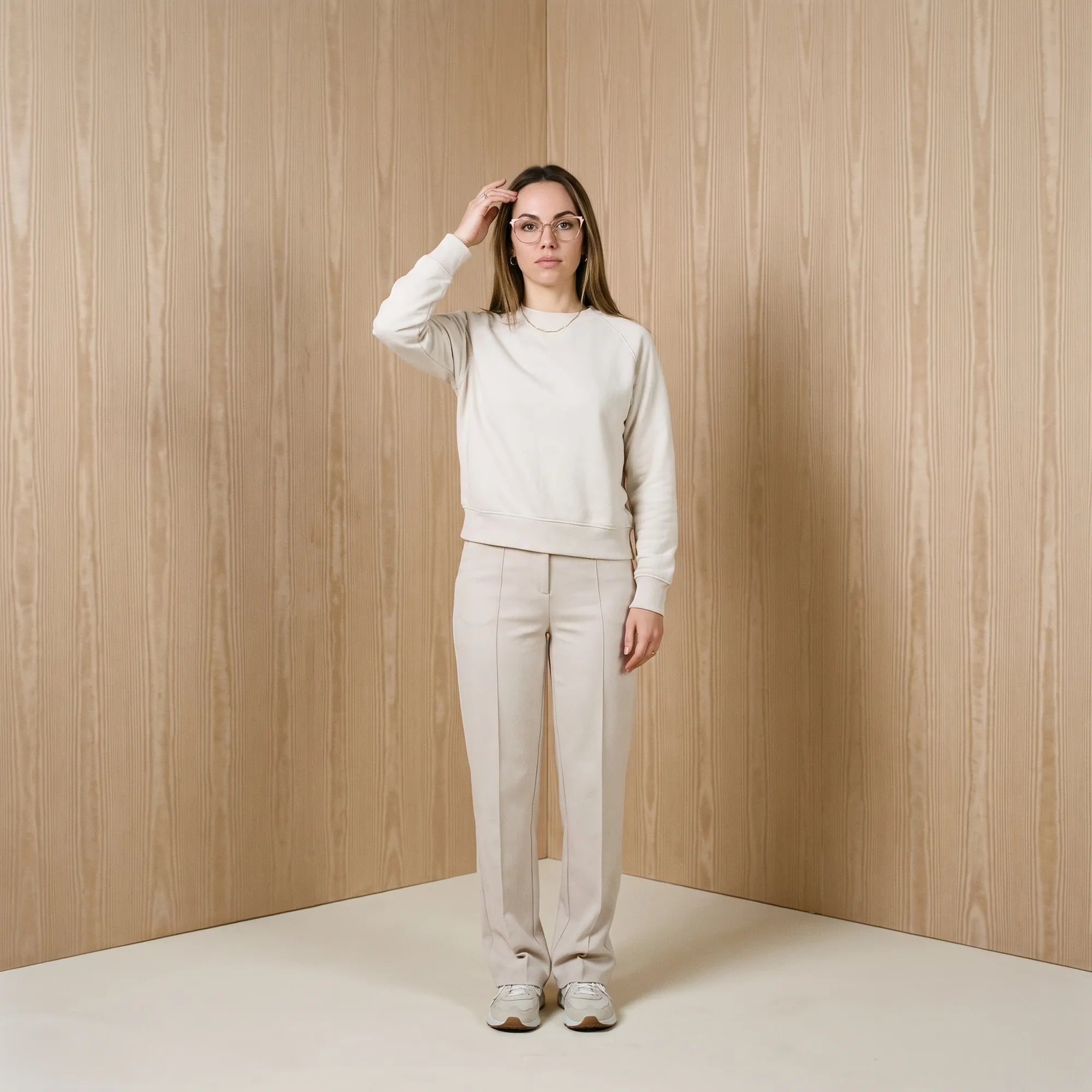 Fiore 3837 eyeglasses in pink gold, worn by a model – campaign portrait, soft portrait in blush moire tones
