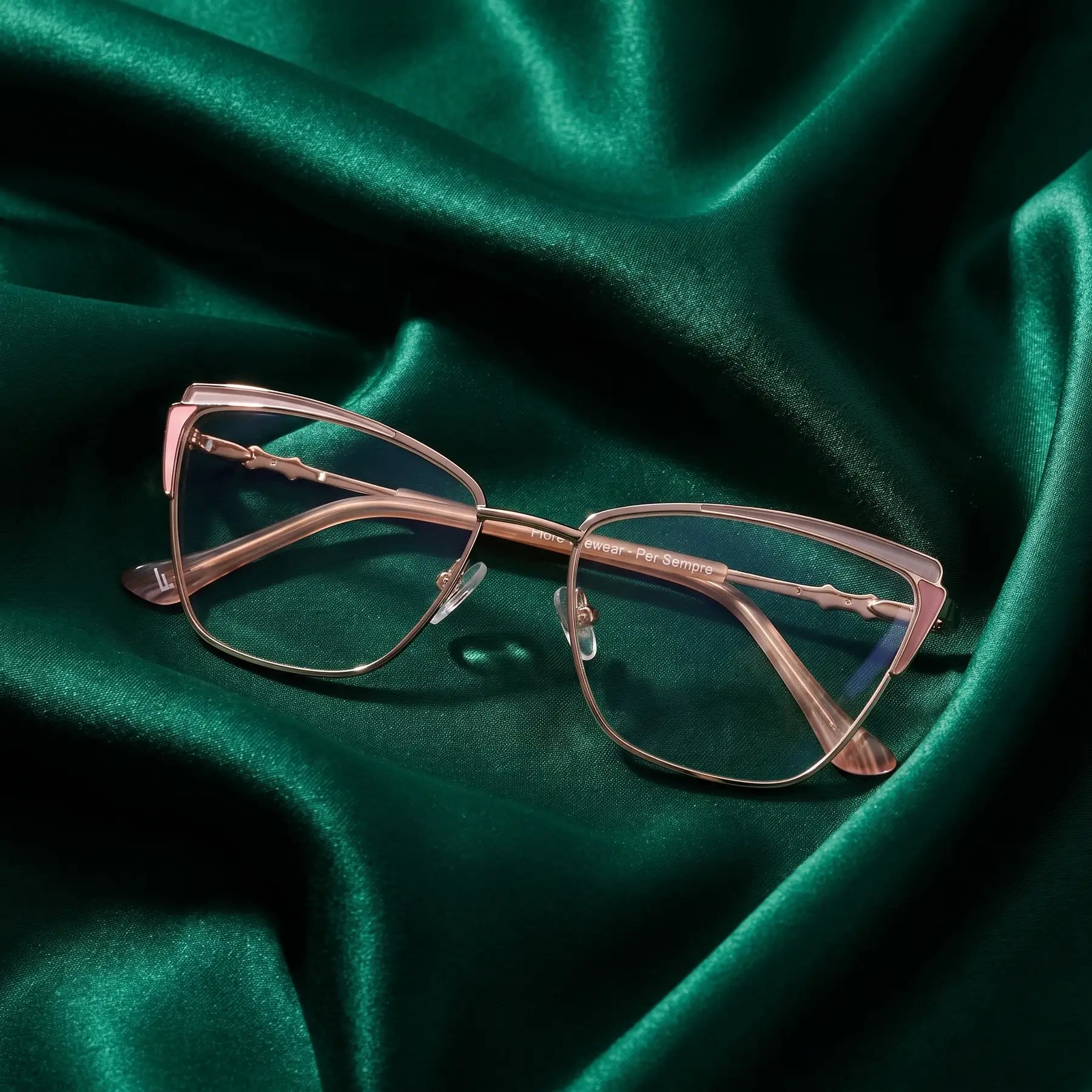 Fiore 3837 eyeglasses in pink gold – nested in flowing emerald silk