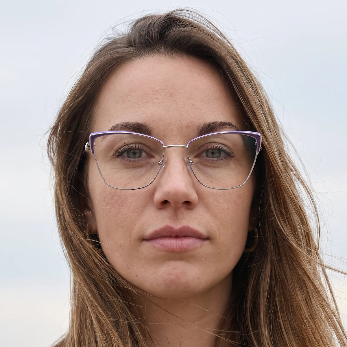 Fiore 3839 eyeglasses in purple silver, worn by a model – campaign portrait, floating together in milky summer water