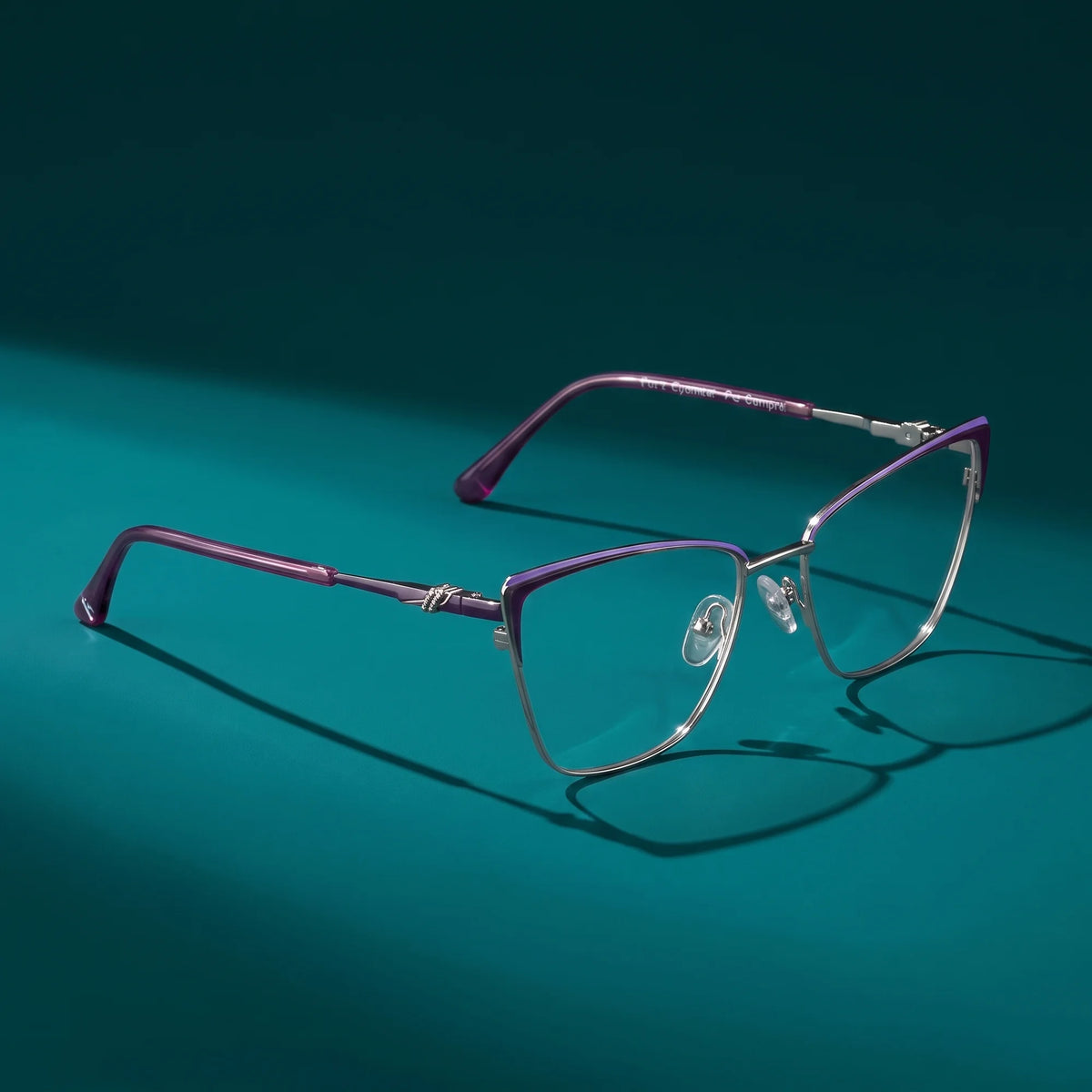 Fiore 3839 eyeglasses in purple silver – hero still life against a deep teal backdrop