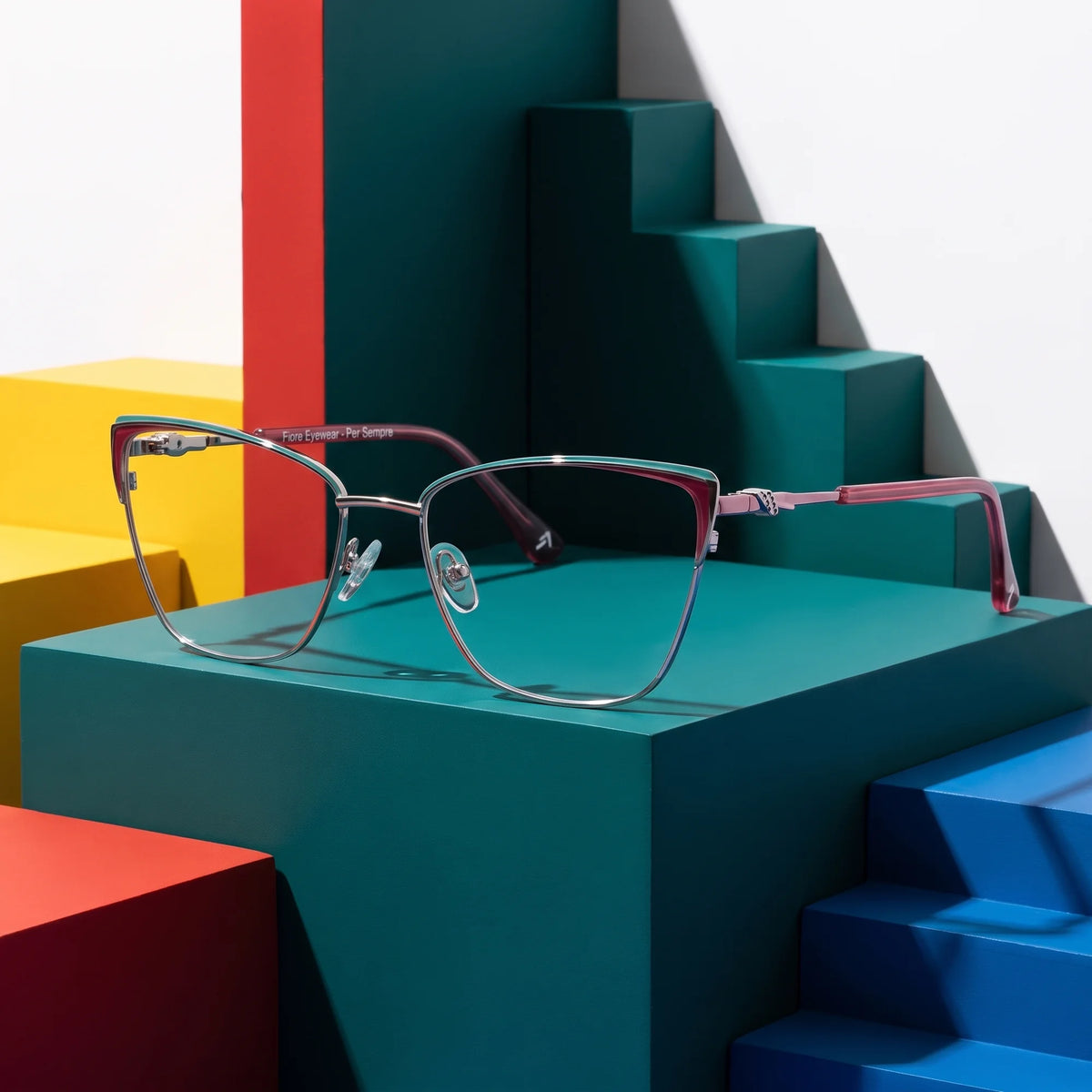 Fiore 3839 eyeglasses in red gun – on bold primary color-block steps