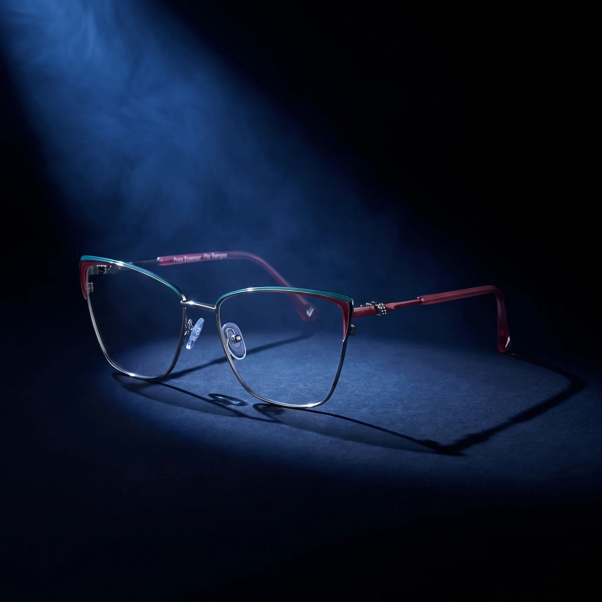 Fiore 3839 eyeglasses in red gun – under a theatrical beam of light