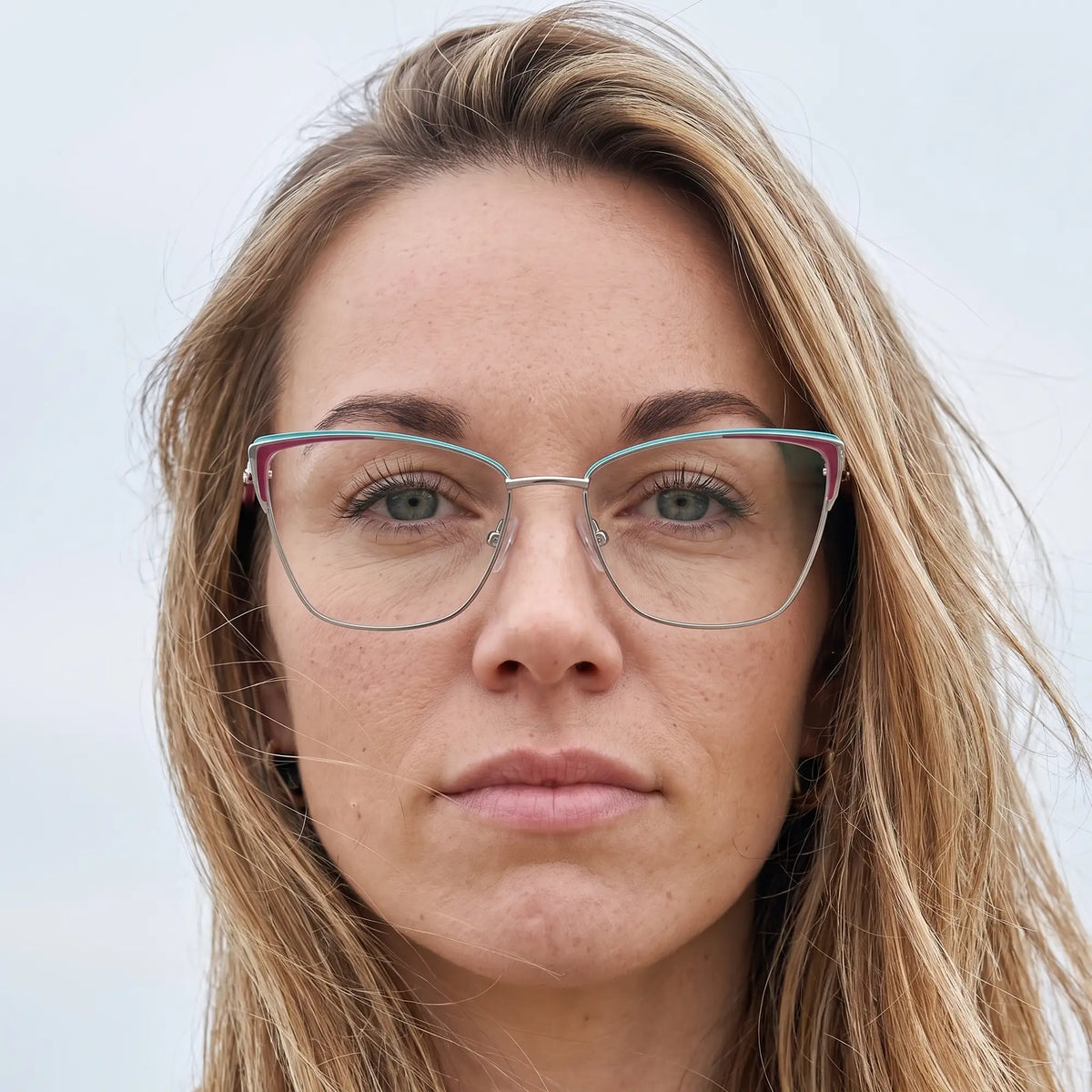 Fiore 3839 eyeglasses in red gun, worn by a model – campaign portrait, floating together in milky summer water