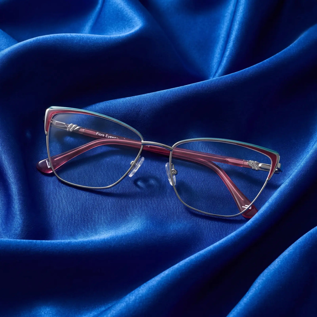 Fiore 3839 eyeglasses in red gun – nested in flowing cobalt silk