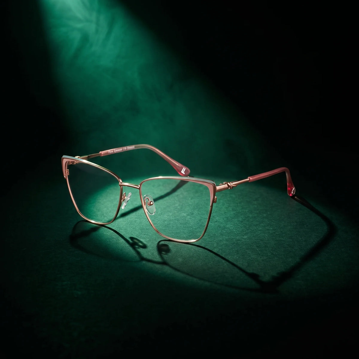 Fiore 3839 eyeglasses in pink gold – under a theatrical beam of light