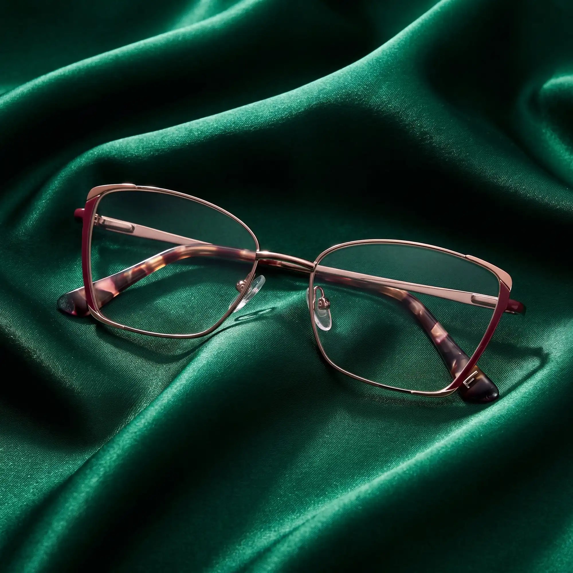 Fiore 3916 eyeglasses in purple pink silver – nested in flowing emerald silk