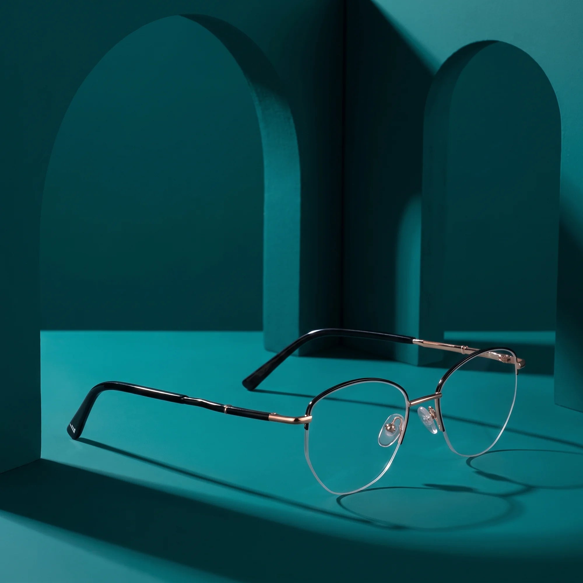 Fiore 3921 eyeglasses in black gold – still life among monochrome teal arches