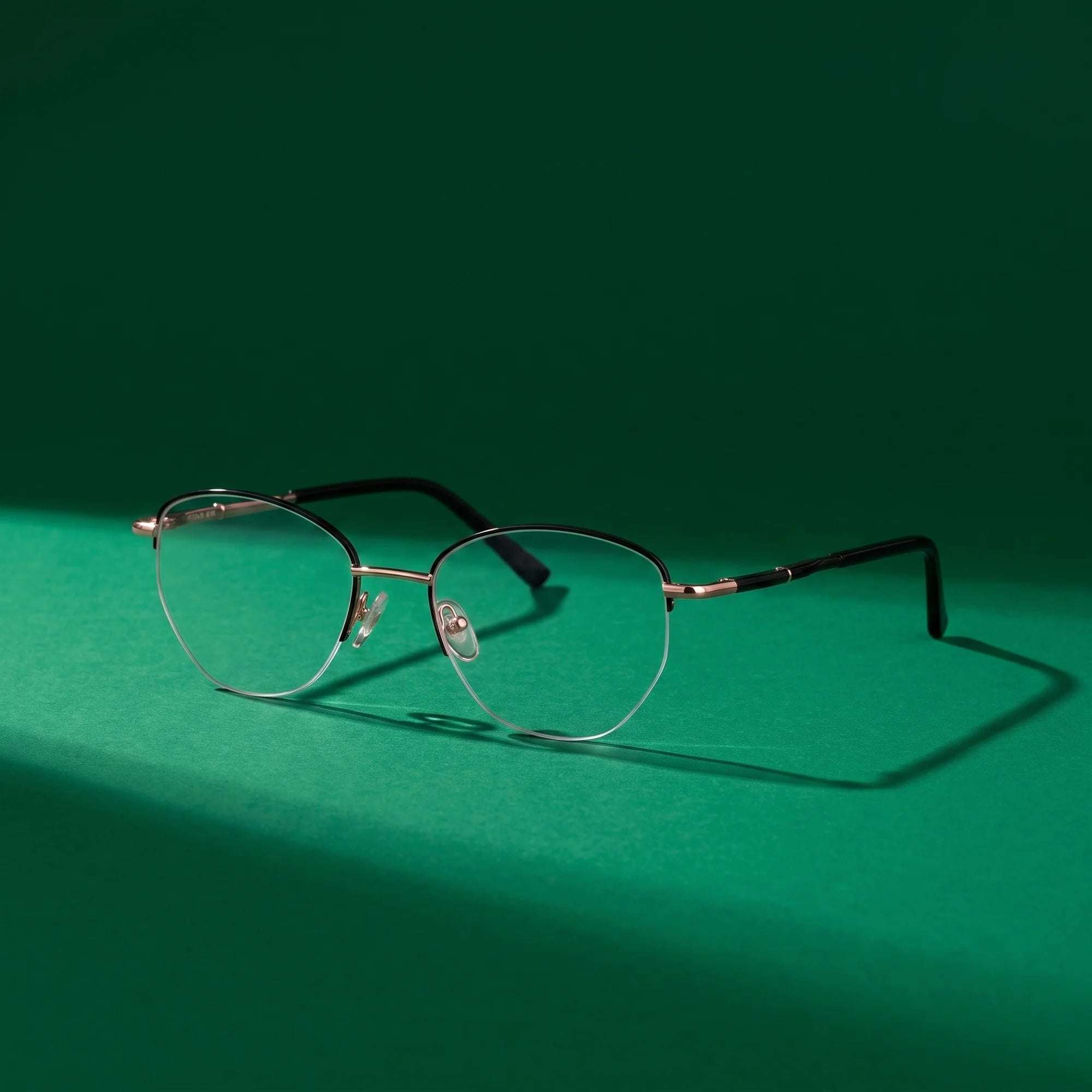Fiore 3921 eyeglasses in black gold – still life on a seamless emerald studio backdrop