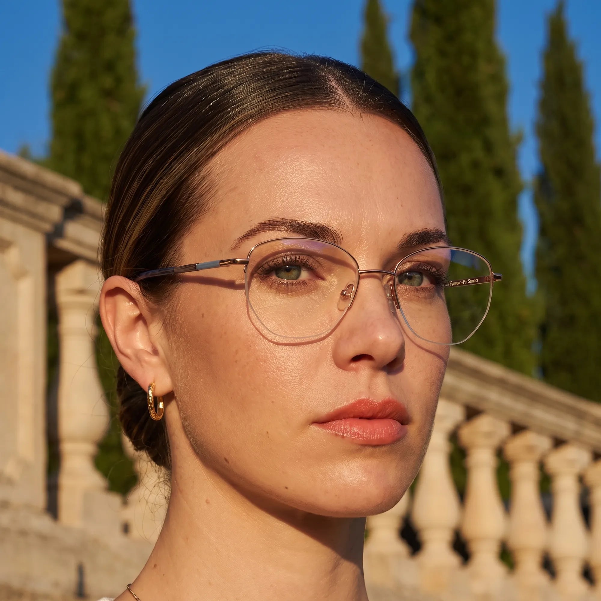 Fiore 3921 eyeglasses in grey brown, worn by a model – campaign portrait, golden-hour Italian villa terrace