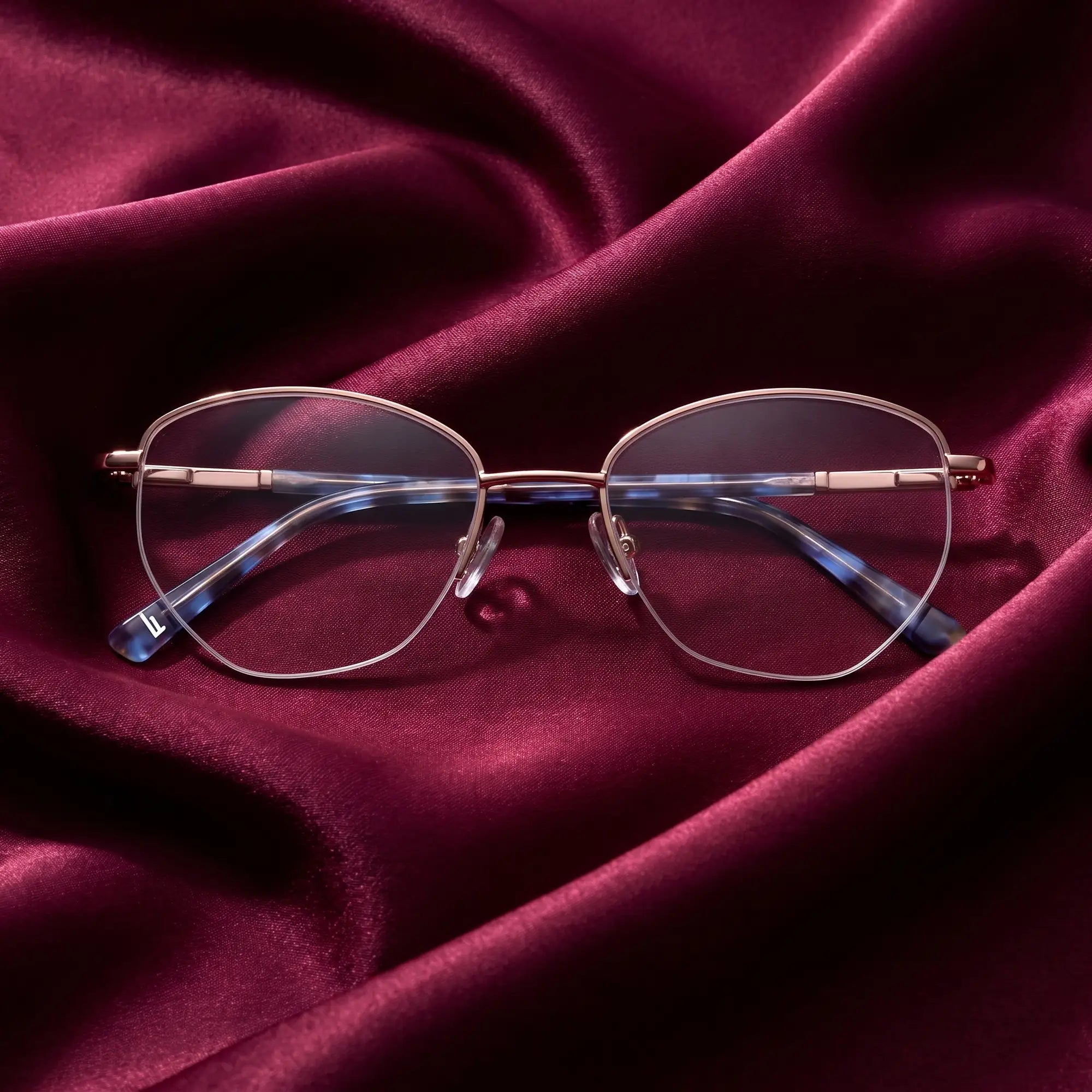 Fiore 3921 eyeglasses in grey brown – nested in flowing burgundy silk