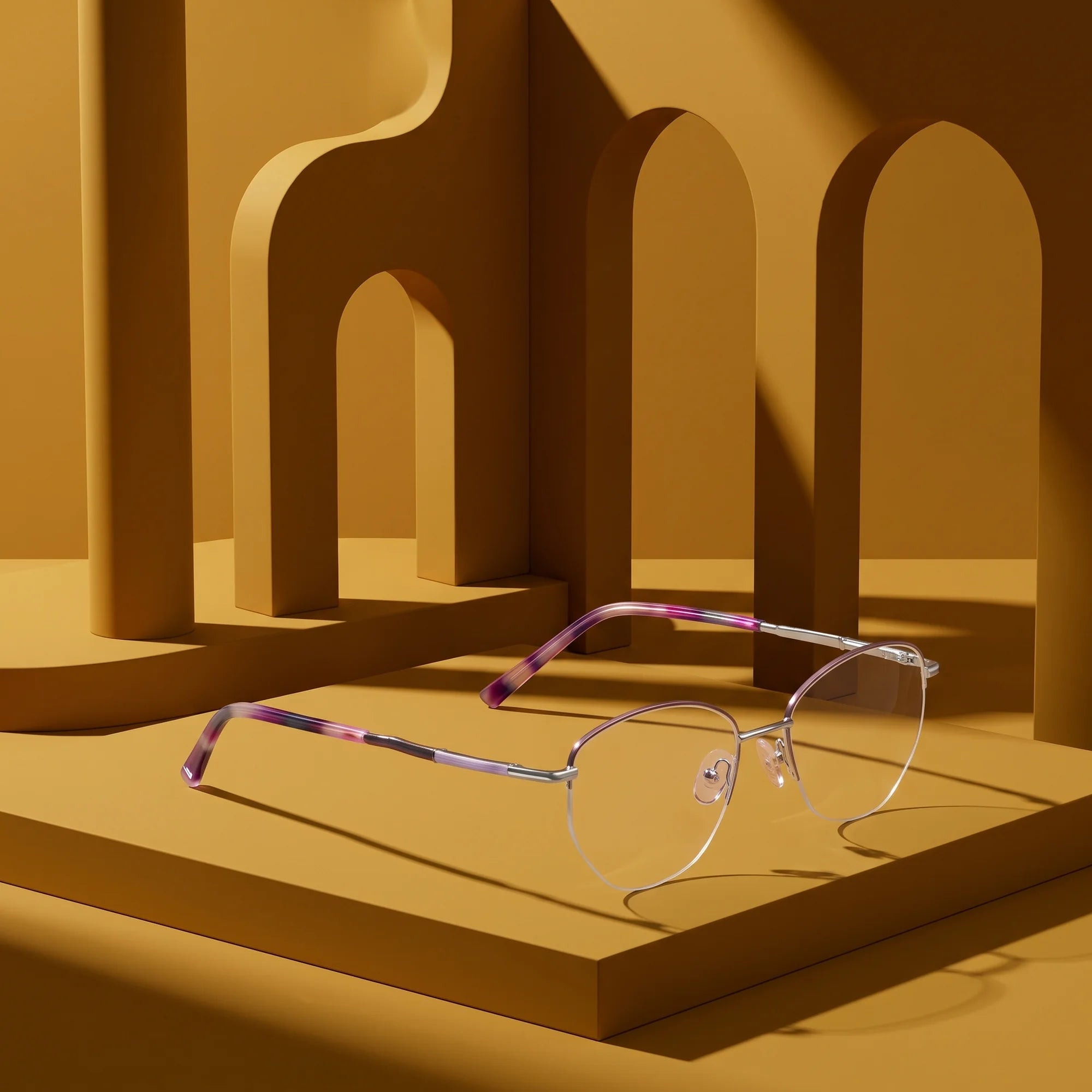 Fiore 3921 eyeglasses in purple silver – displayed on a mustard ochre podium among arches