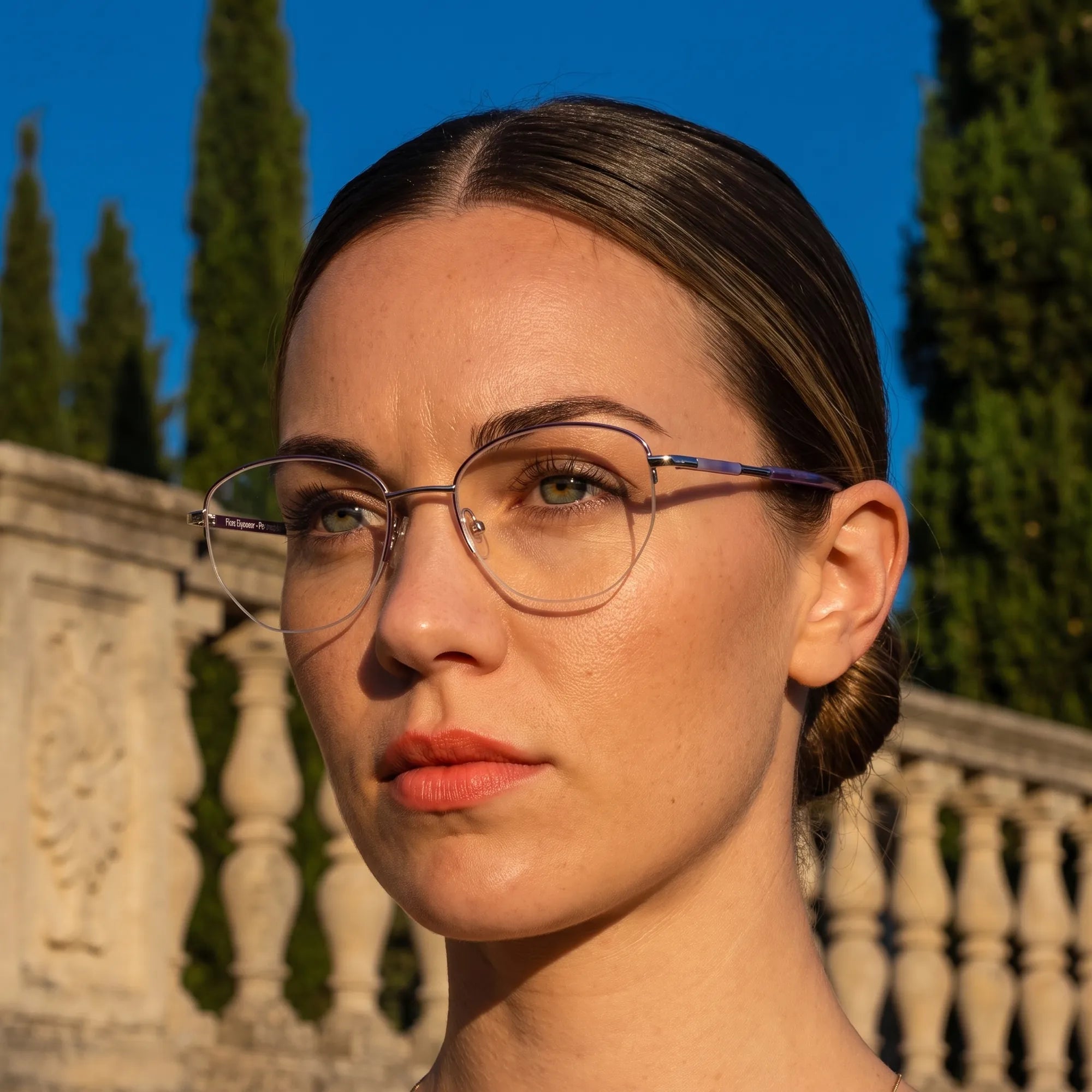 Fiore 3921 eyeglasses in purple silver, worn by a model – campaign portrait, golden-hour Italian villa terrace