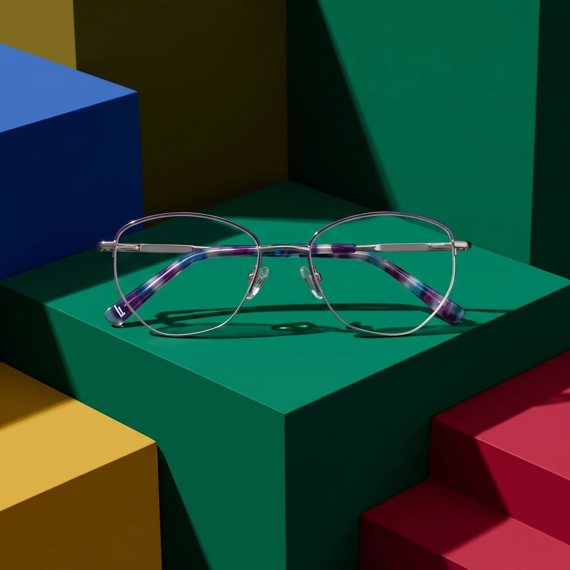 Fiore 3921 eyeglasses in purple silver – on bold primary color-block steps