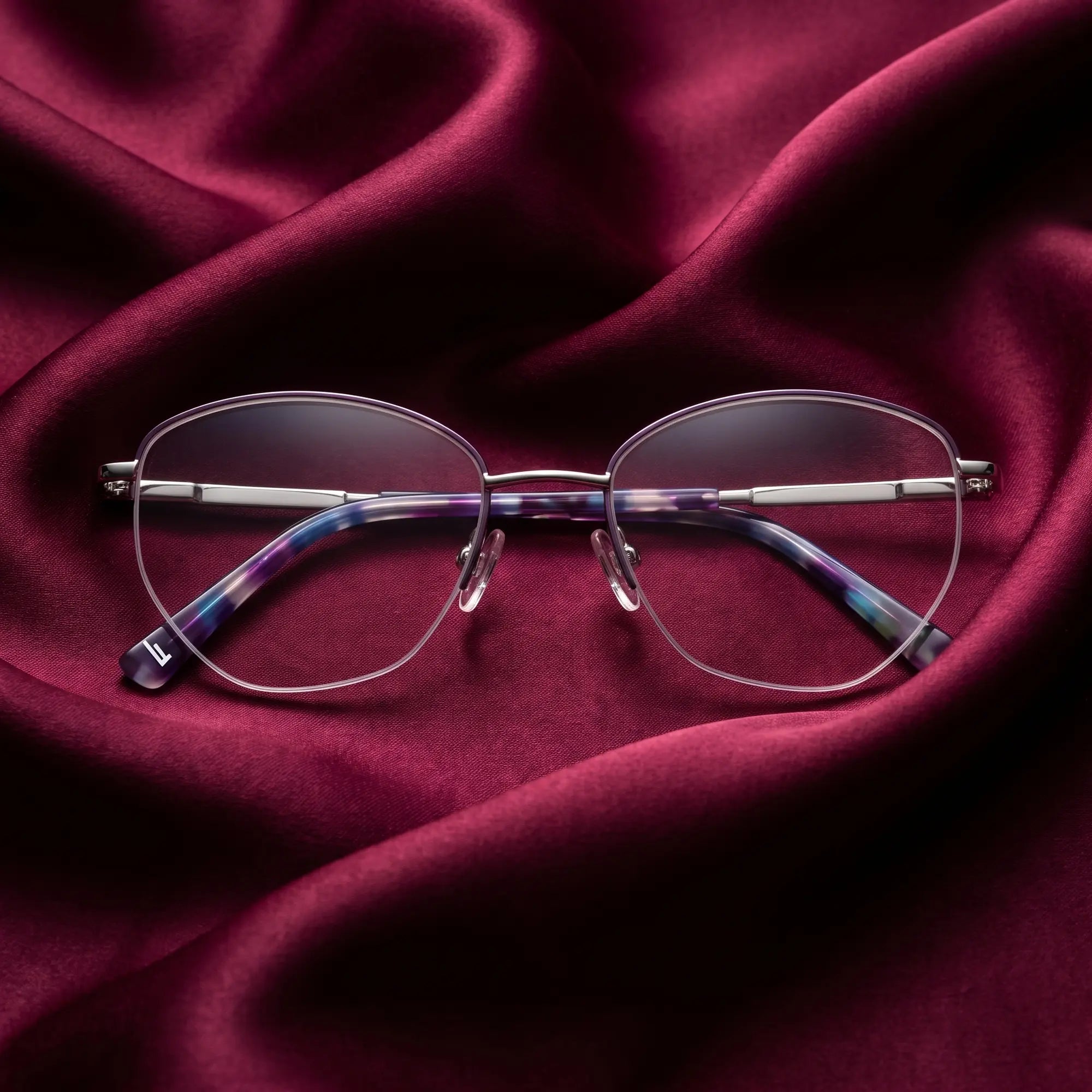 Fiore 3921 eyeglasses in purple silver – nested in flowing burgundy silk
