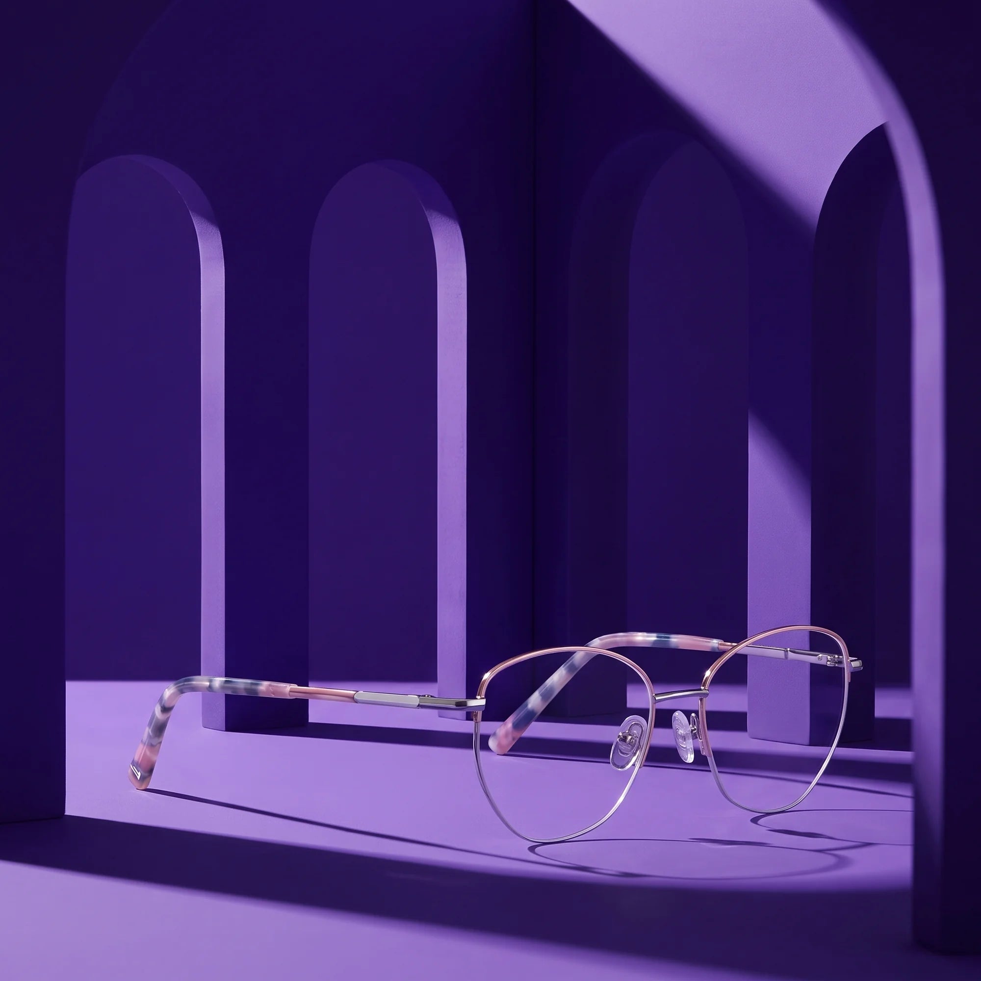 Fiore 3921 eyeglasses in pink silver – still life among monochrome violet arches