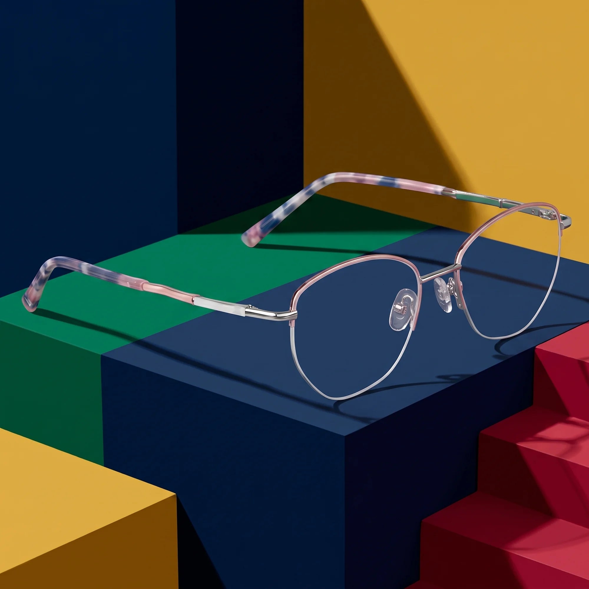 Fiore 3921 eyeglasses in pink silver – on bold primary color-block steps