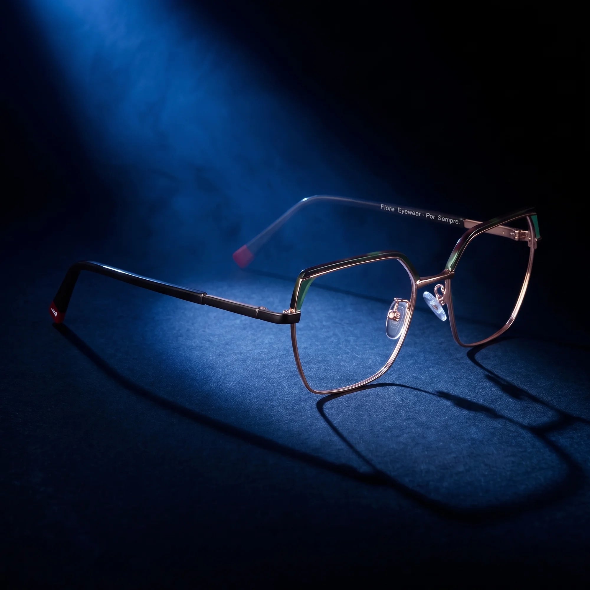 Fiore 3971 eyeglasses in black gold – under a theatrical beam of light
