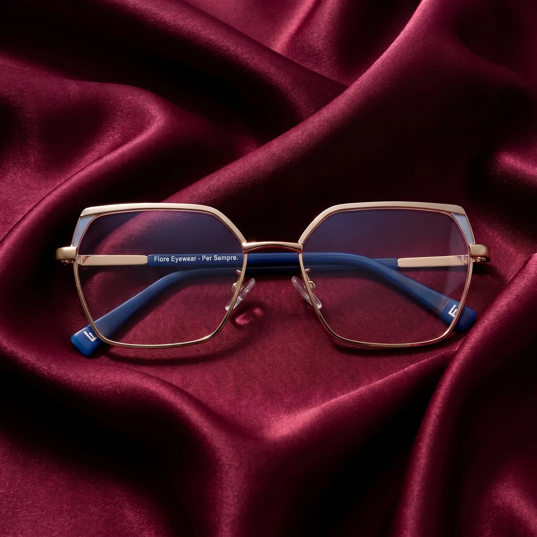 Fiore 3971 eyeglasses in grey gold – nested in flowing burgundy silk