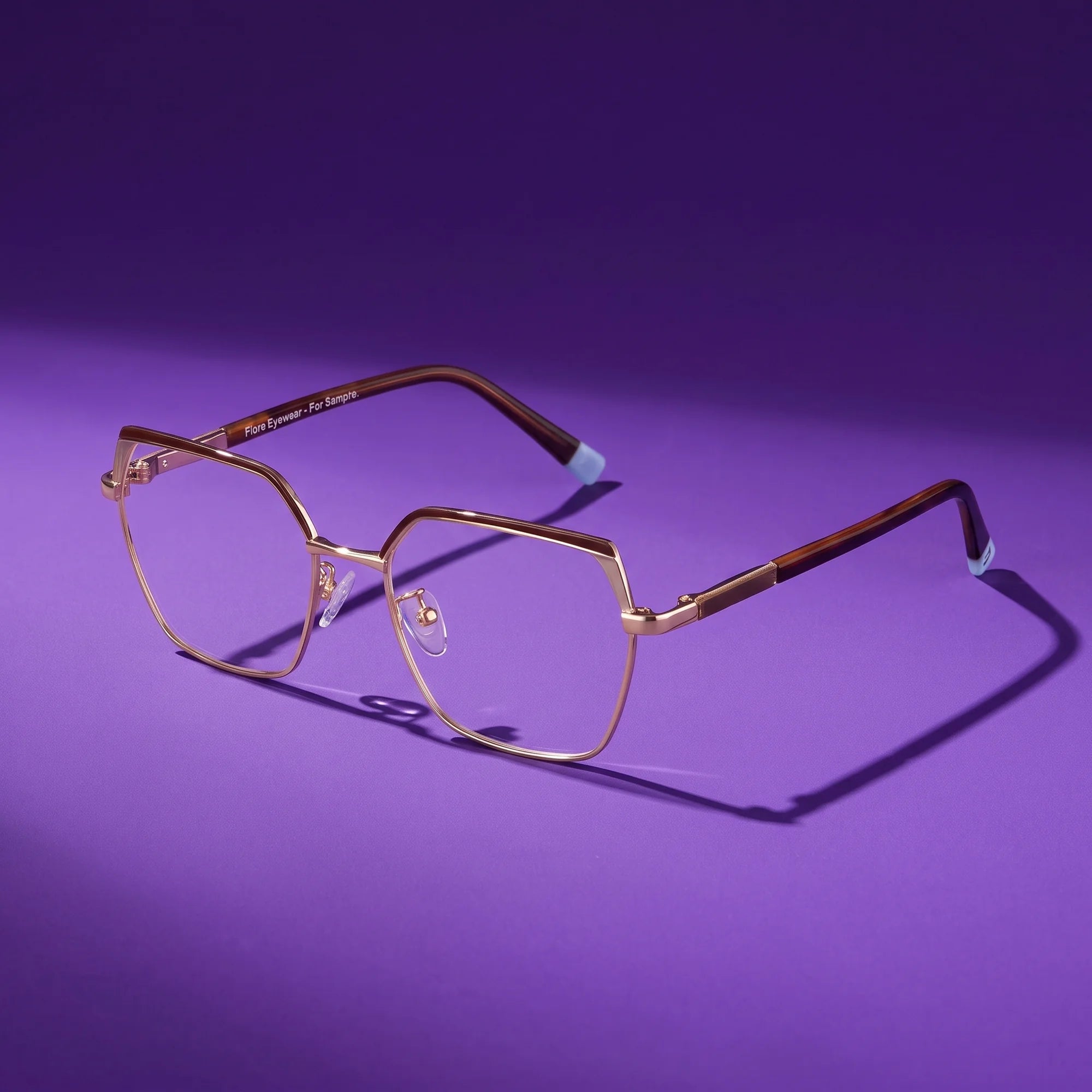 Fiore 3971 eyeglasses in brown gold – hero still life against a deep violet backdrop