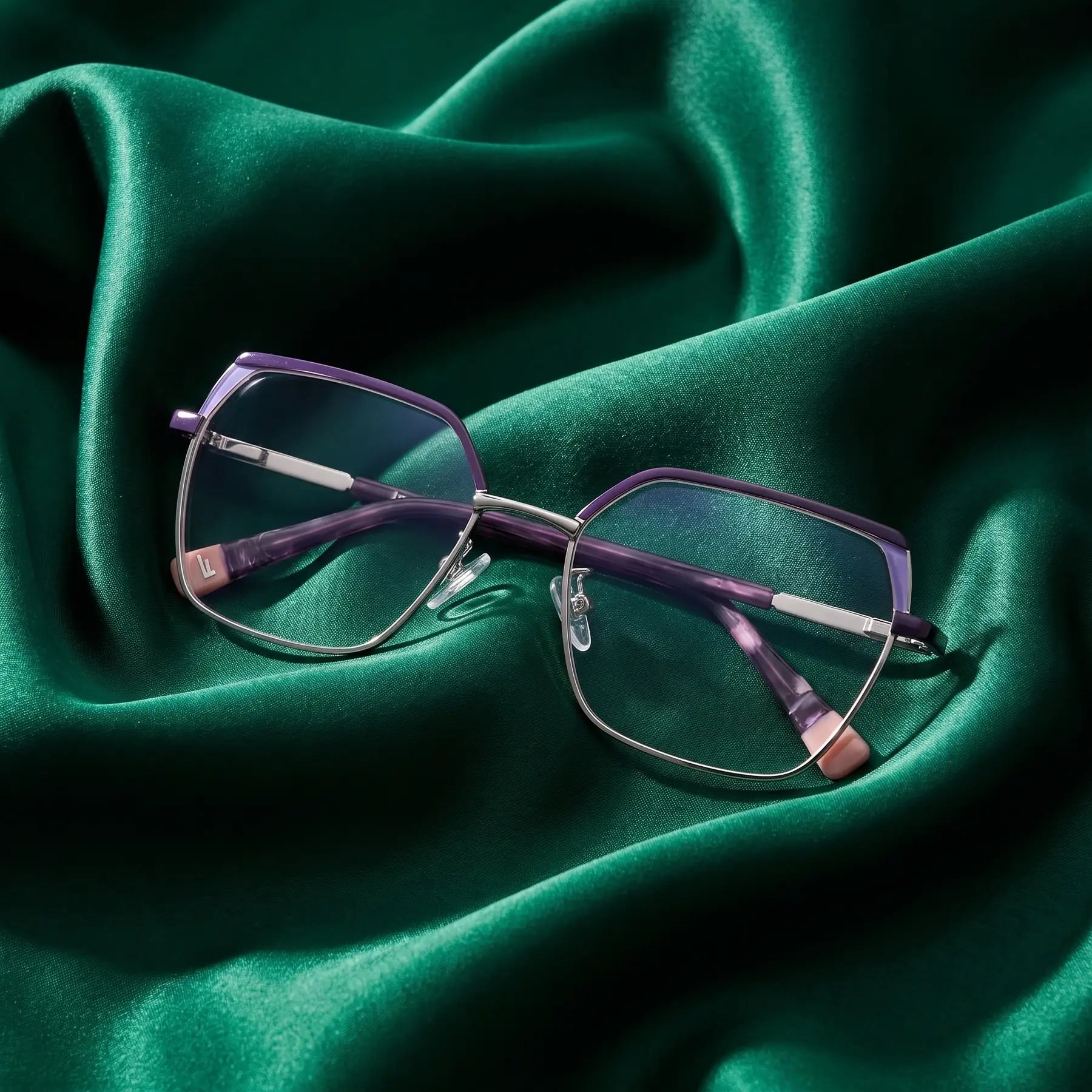 Fiore 3971 eyeglasses in purple silver – nested in flowing emerald silk