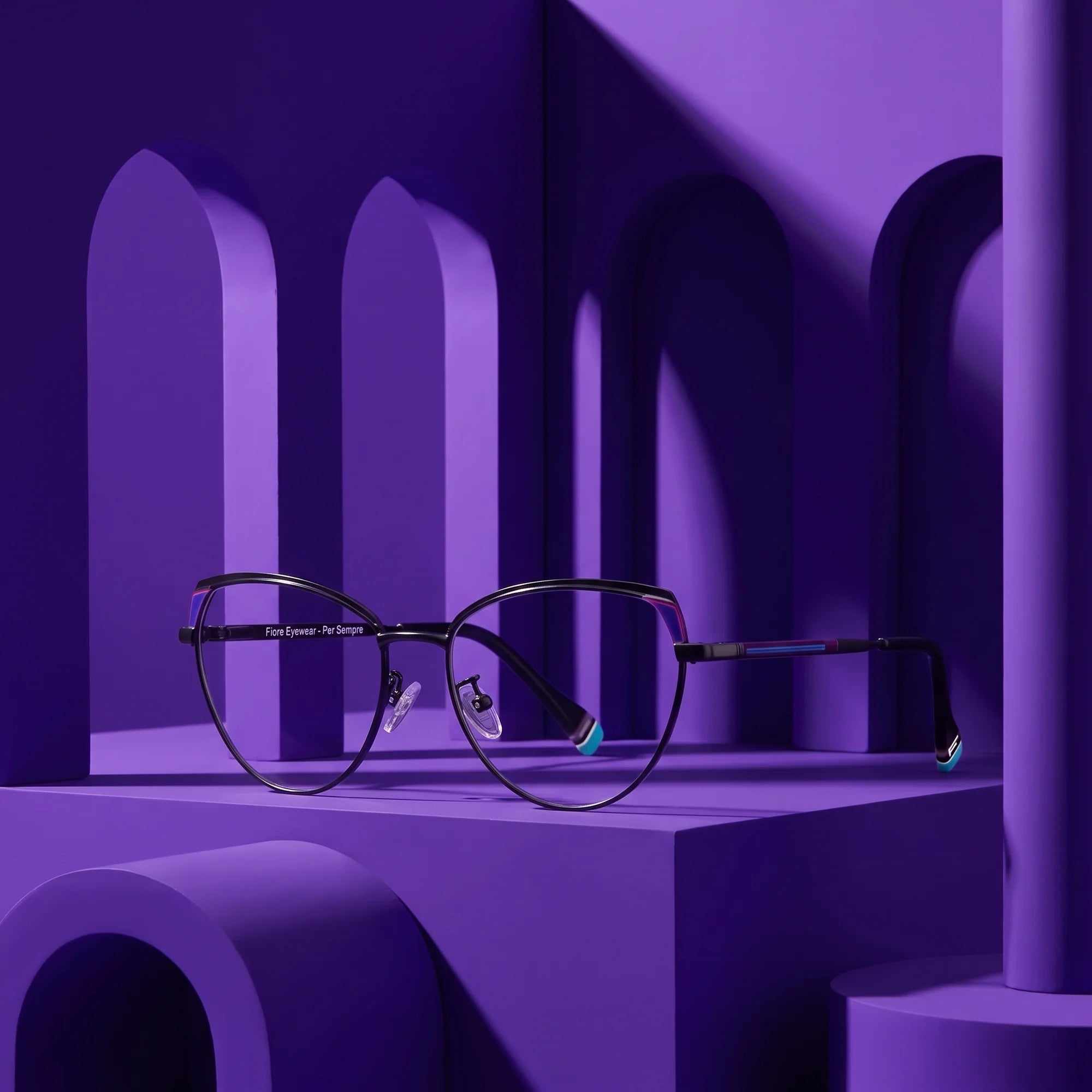 Fiore 3983 eyeglasses in black blue – displayed on a violet podium among arches