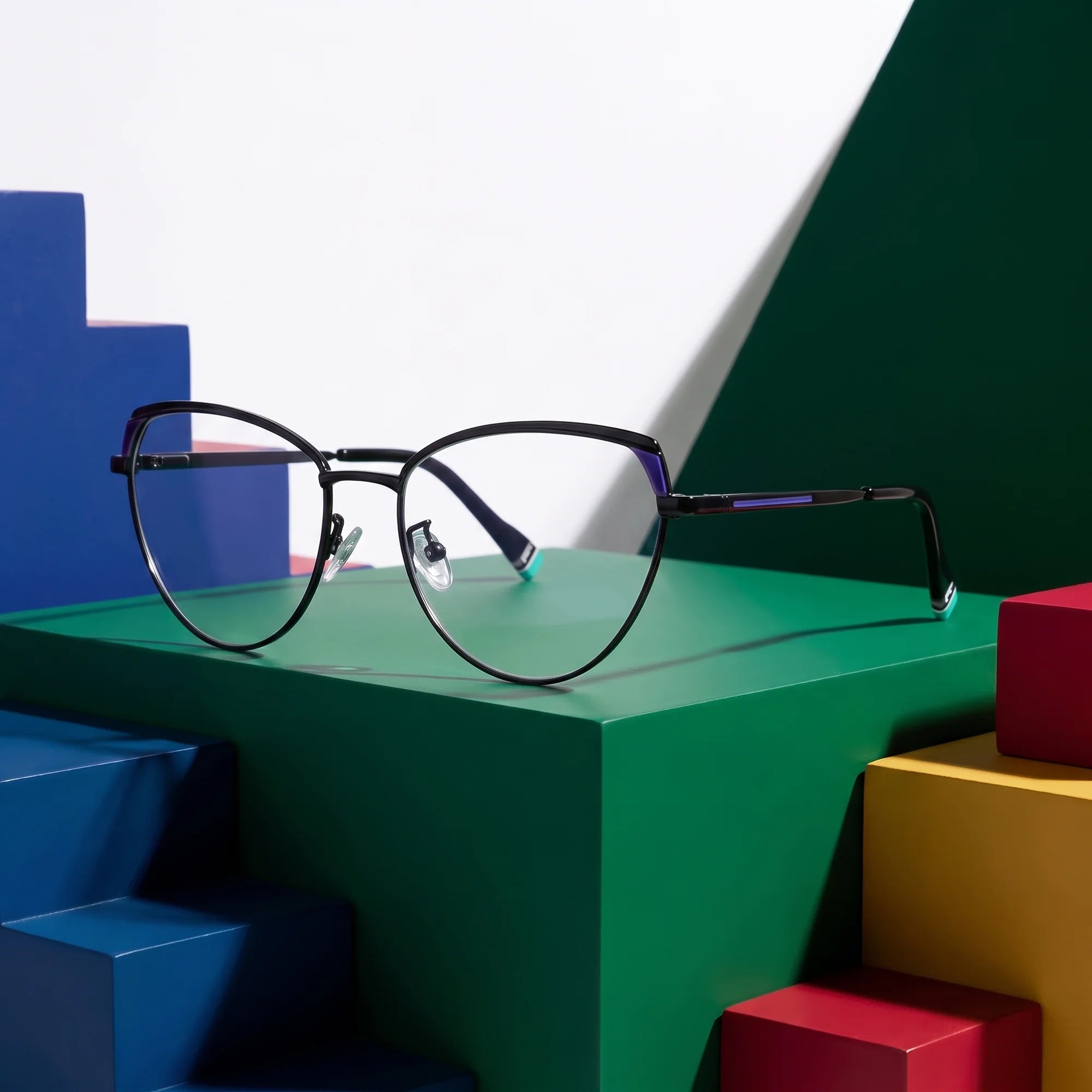 Fiore 3983 eyeglasses in black blue – on bold primary color-block steps
