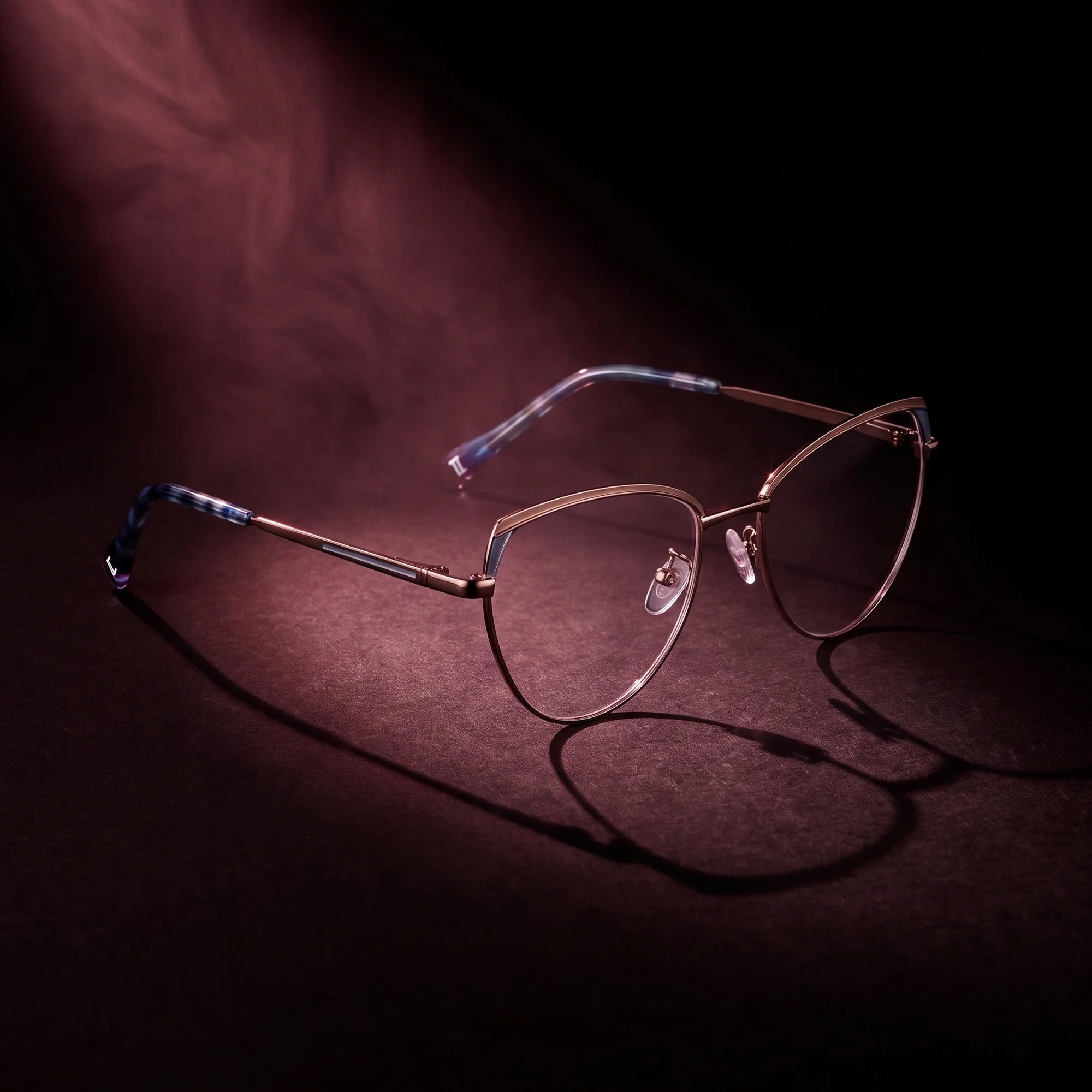 Fiore 3983 eyeglasses in grey gun – under a theatrical beam of light