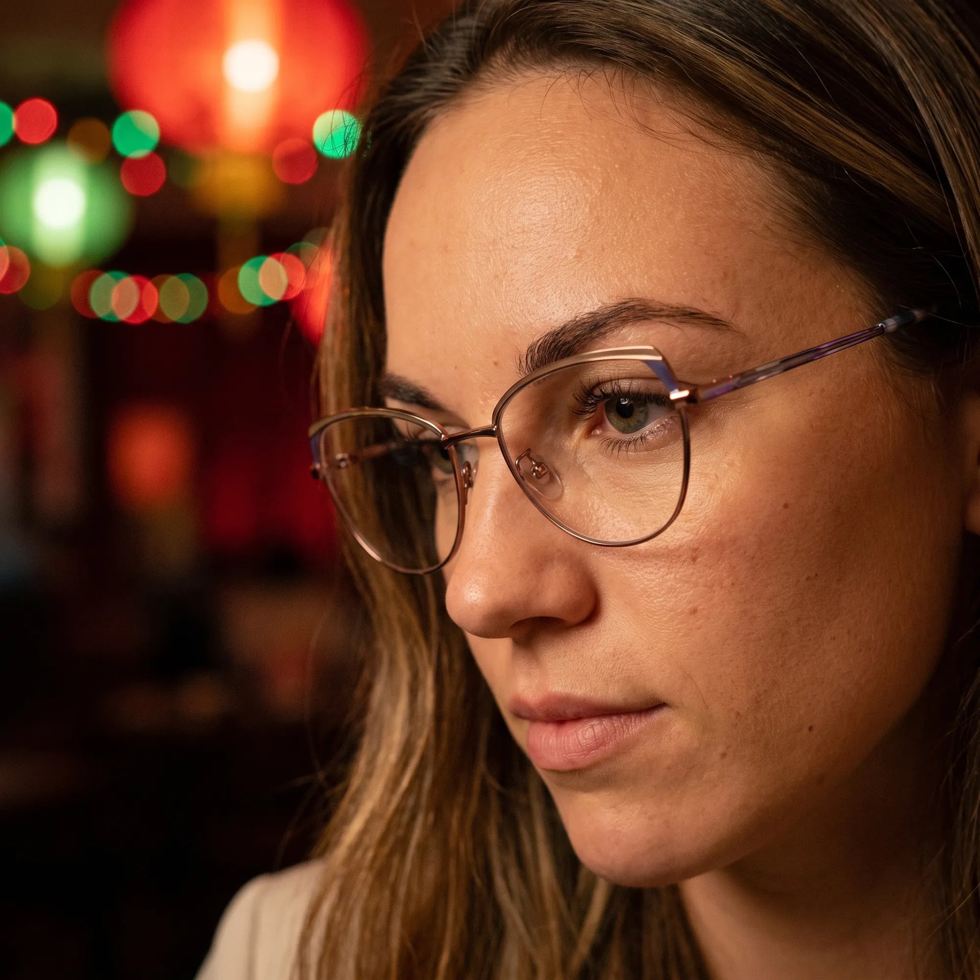 Fiore 3983 eyeglasses in grey gun, worn by a model – campaign portrait, candid portrait in neon-lit evening glow