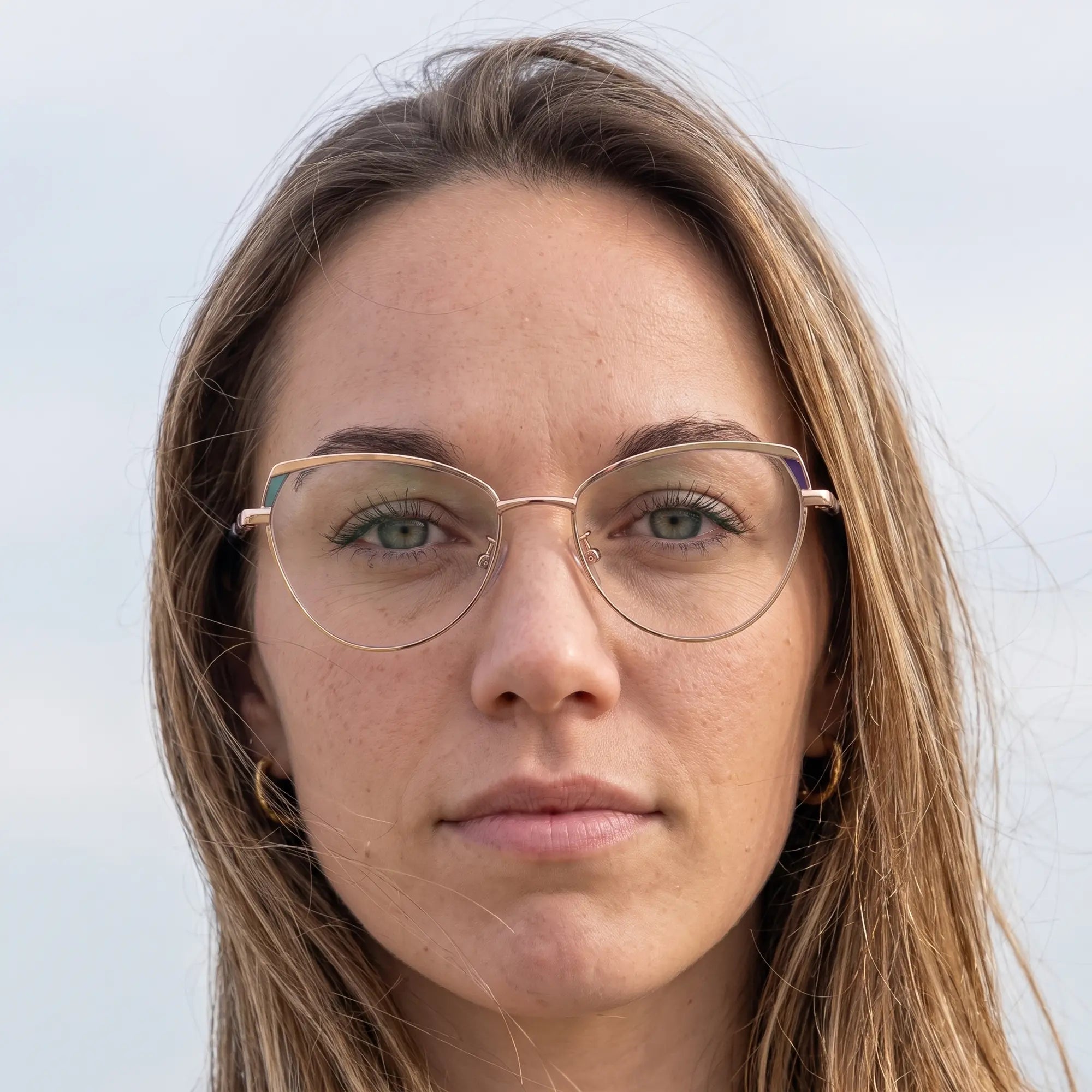 Fiore 3983 eyeglasses in grey gun, worn by a model – campaign portrait, floating together in milky summer water