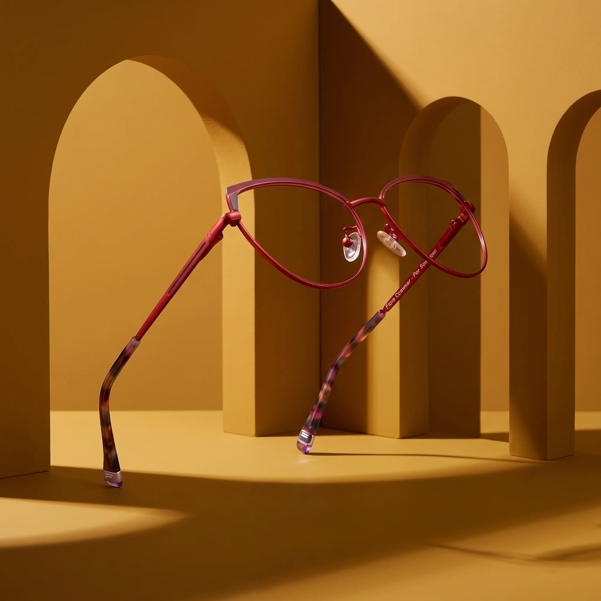 Fiore 3983 eyeglasses in red black – still life among monochrome mustard ochre arches