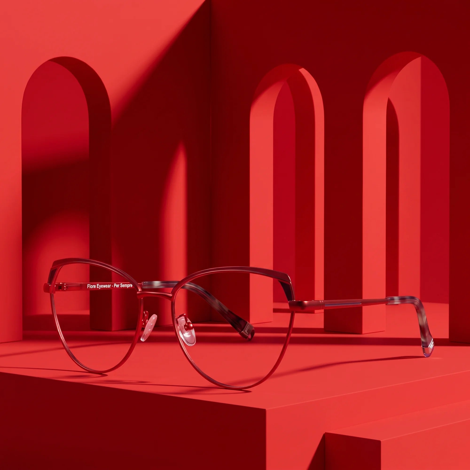 Fiore 3983 eyeglasses in red black – displayed on a vivid red podium among arches