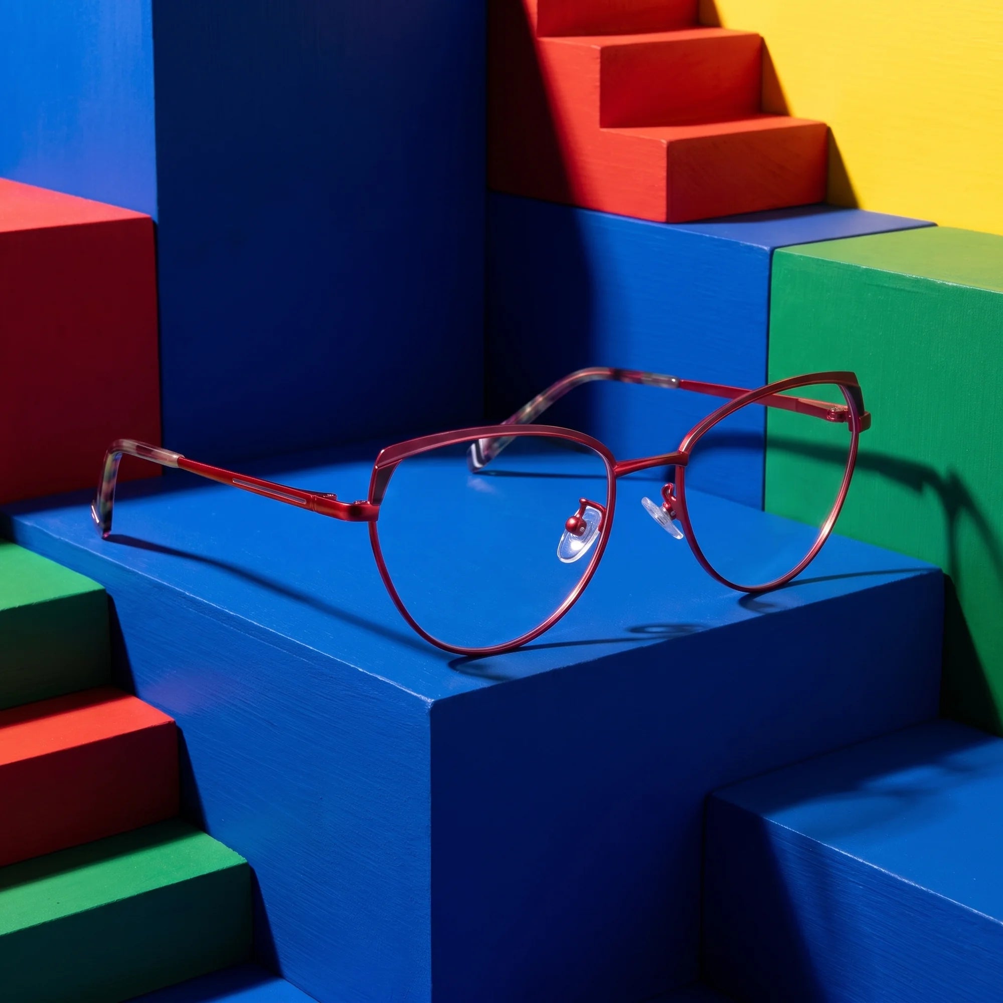 Fiore 3983 eyeglasses in red black – on bold primary color-block steps