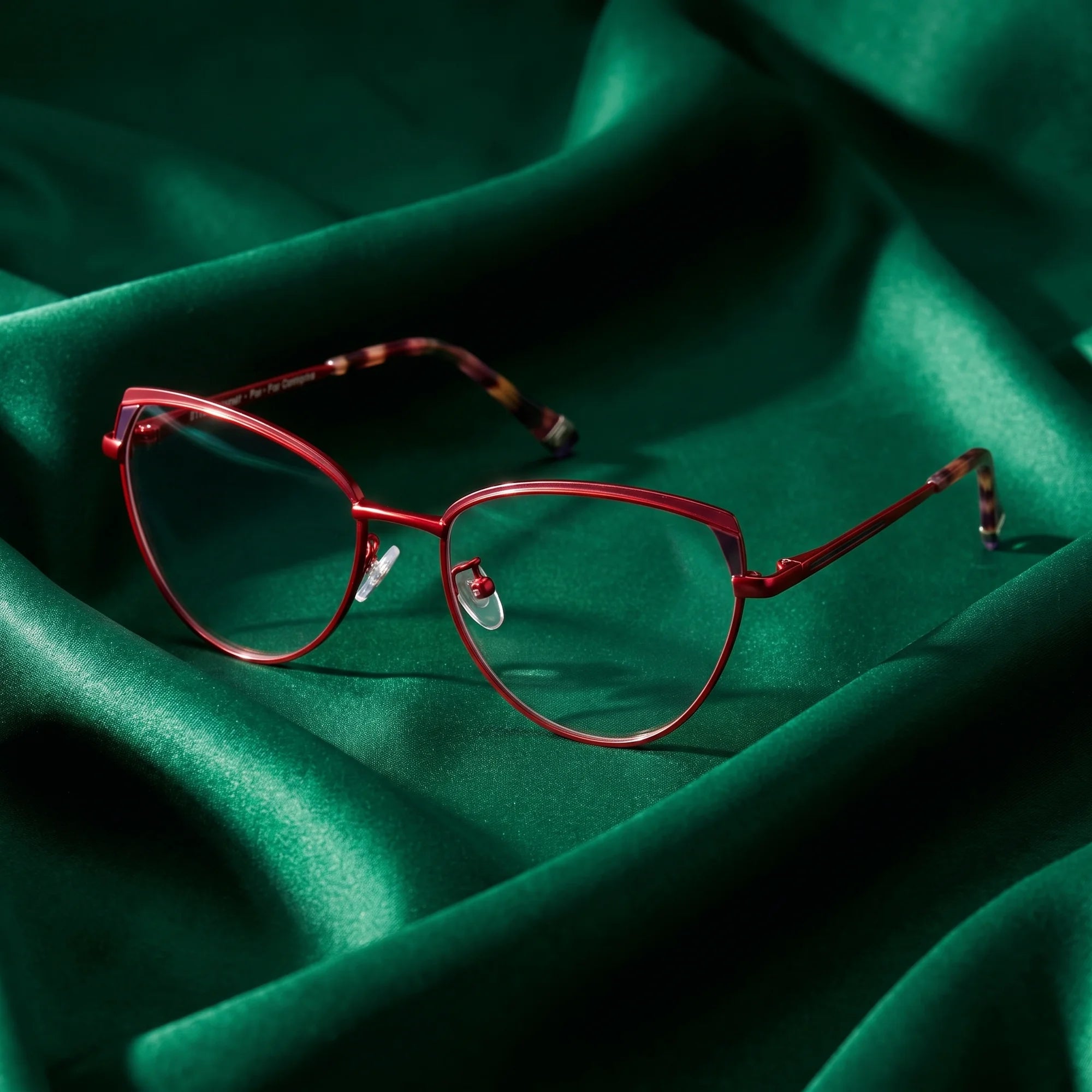 Fiore 3983 eyeglasses in red black – nested in flowing emerald silk