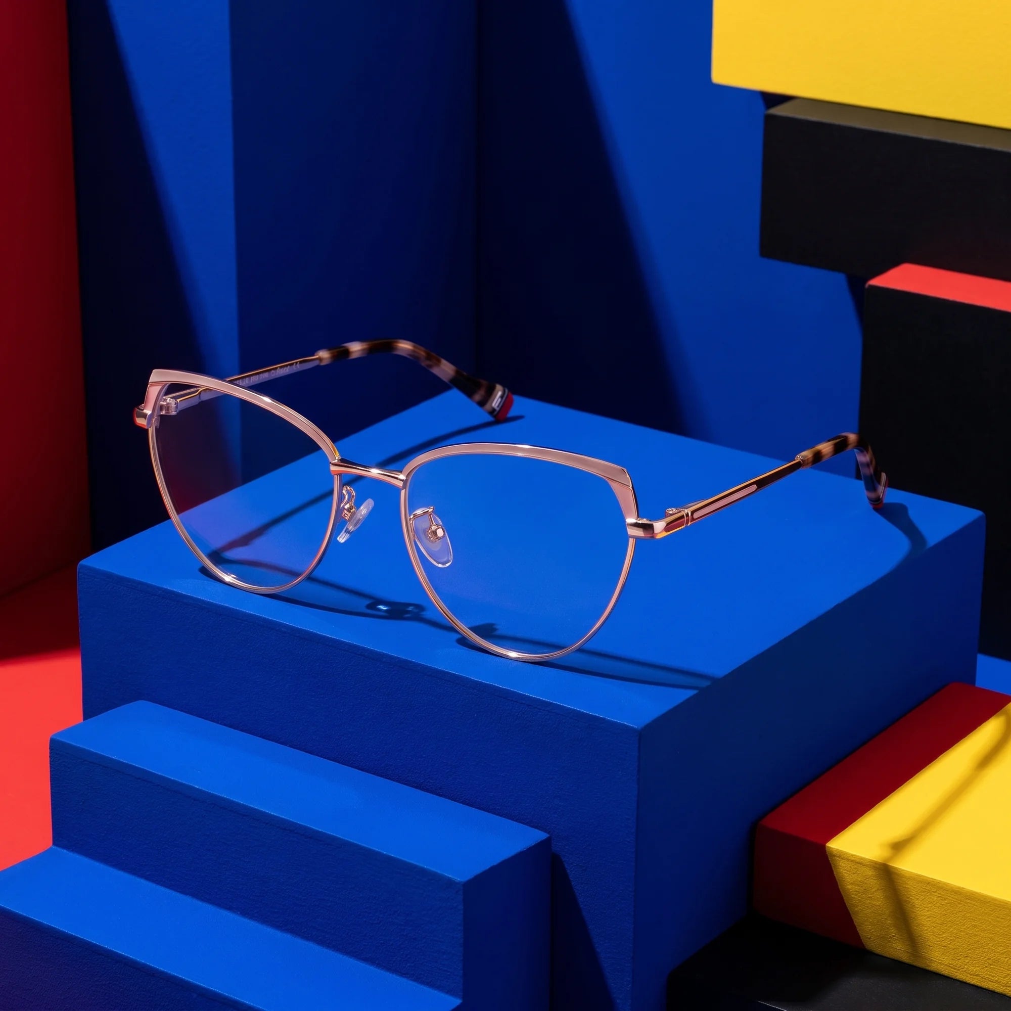 Fiore 3983 eyeglasses in pink gold – on bold primary color-block steps