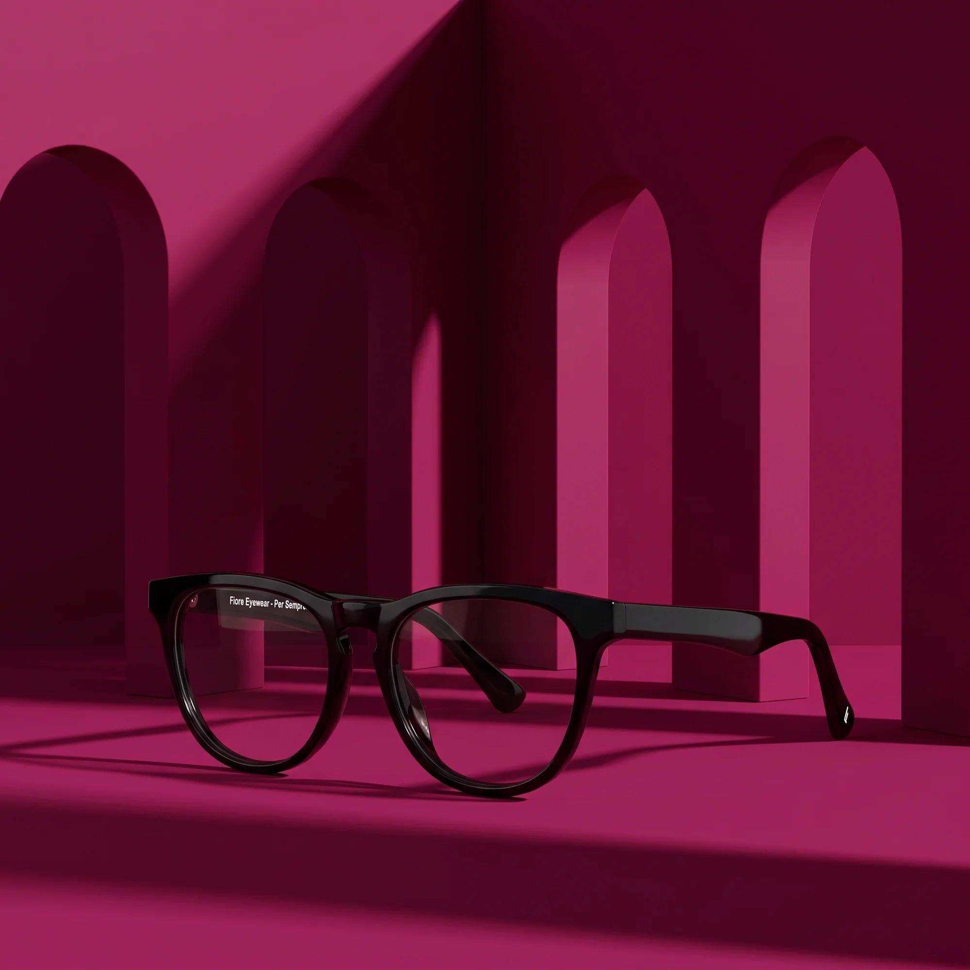 Fiore 4488 eyeglasses in black – staged on a sculptural magenta architecture set