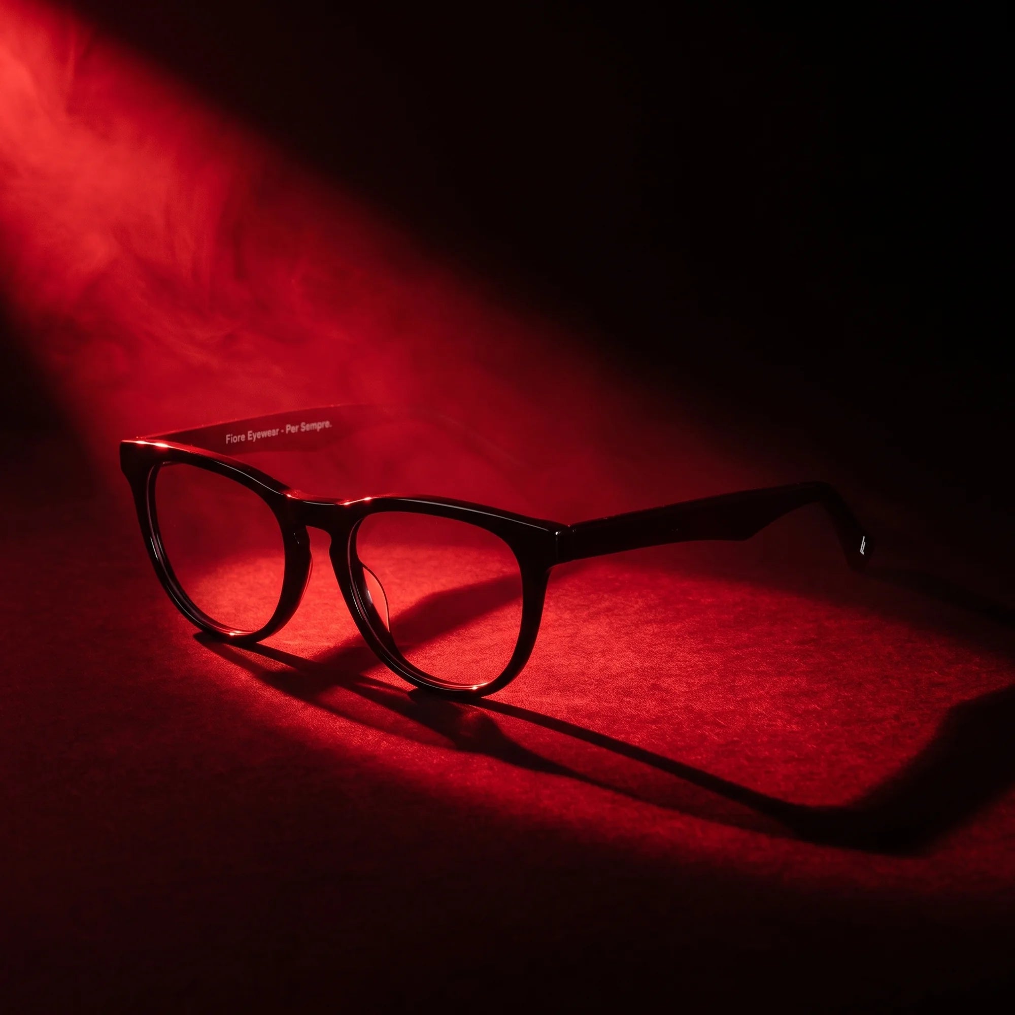Fiore 4488 eyeglasses in black – under a theatrical beam of light