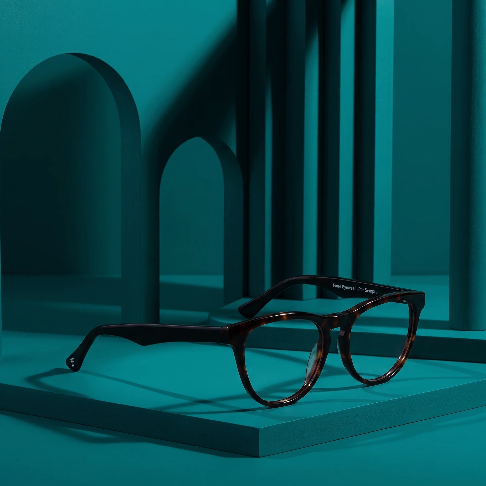 Fiore 4488 eyeglasses in tortoiseshell – still life among monochrome teal arches